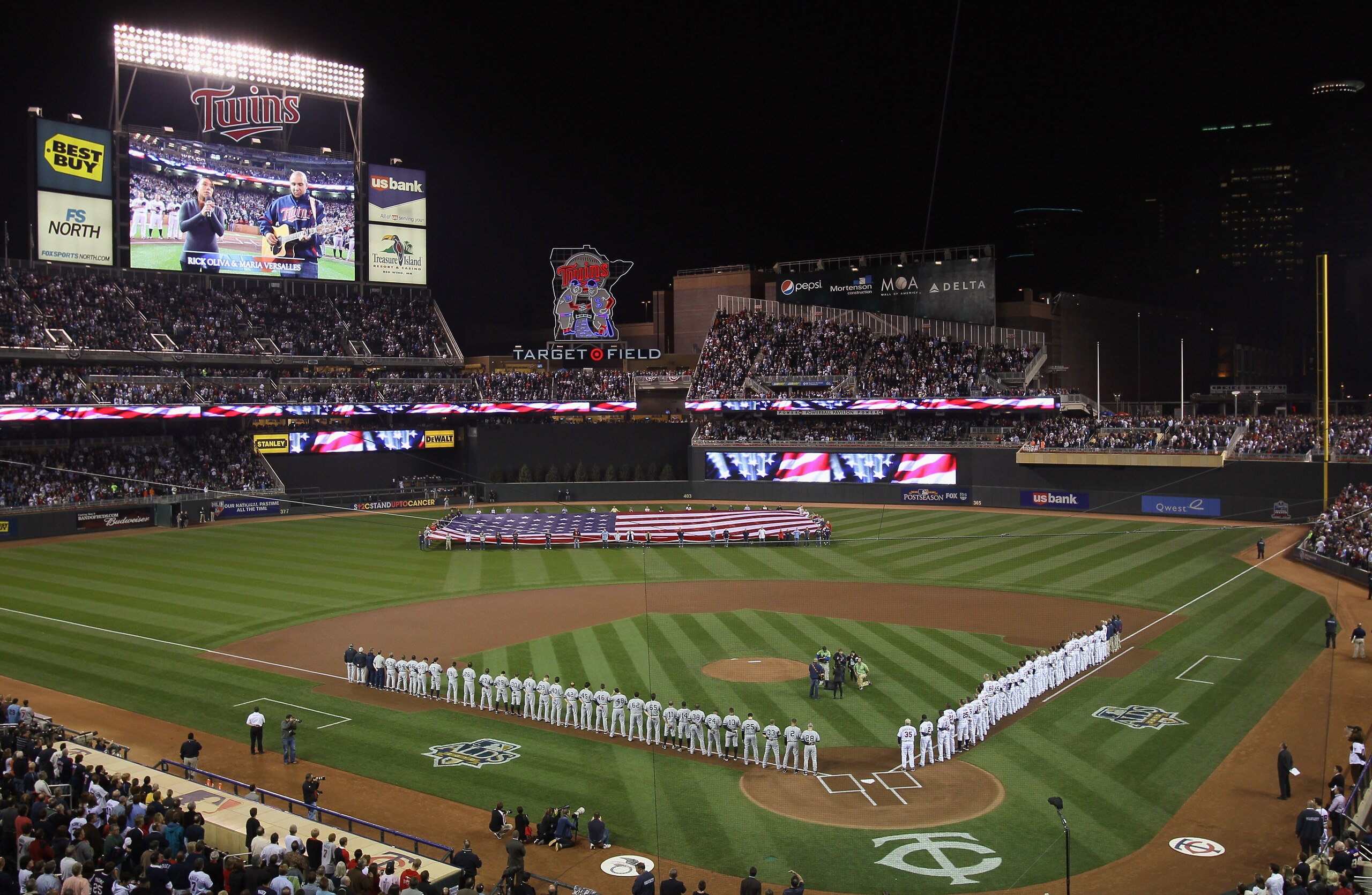 MINNEAPOLIS - OCTOBER 06:  The Minnesota Twins  and the New York Yankees line up before game one of the ALDS on October 6, 2010 at Target Field in Minneapolis, Minnesota.  (Photo by Elsa/Getty Images)
