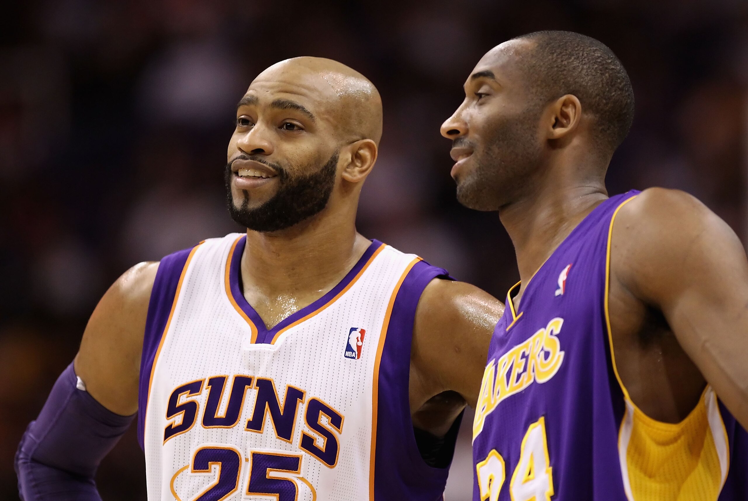 PHOENIX - JANUARY 05: Vince Carter #25 of the Phoenix Suns and Kobe Bryant #24 of the Los Angeles Lakers during the NBA game at US Airways Center on January 5, 2011 in Phoenix, Arizona. The Lakers defeated the Suns 99-95. NOTE TO USER: User expressly ackn
