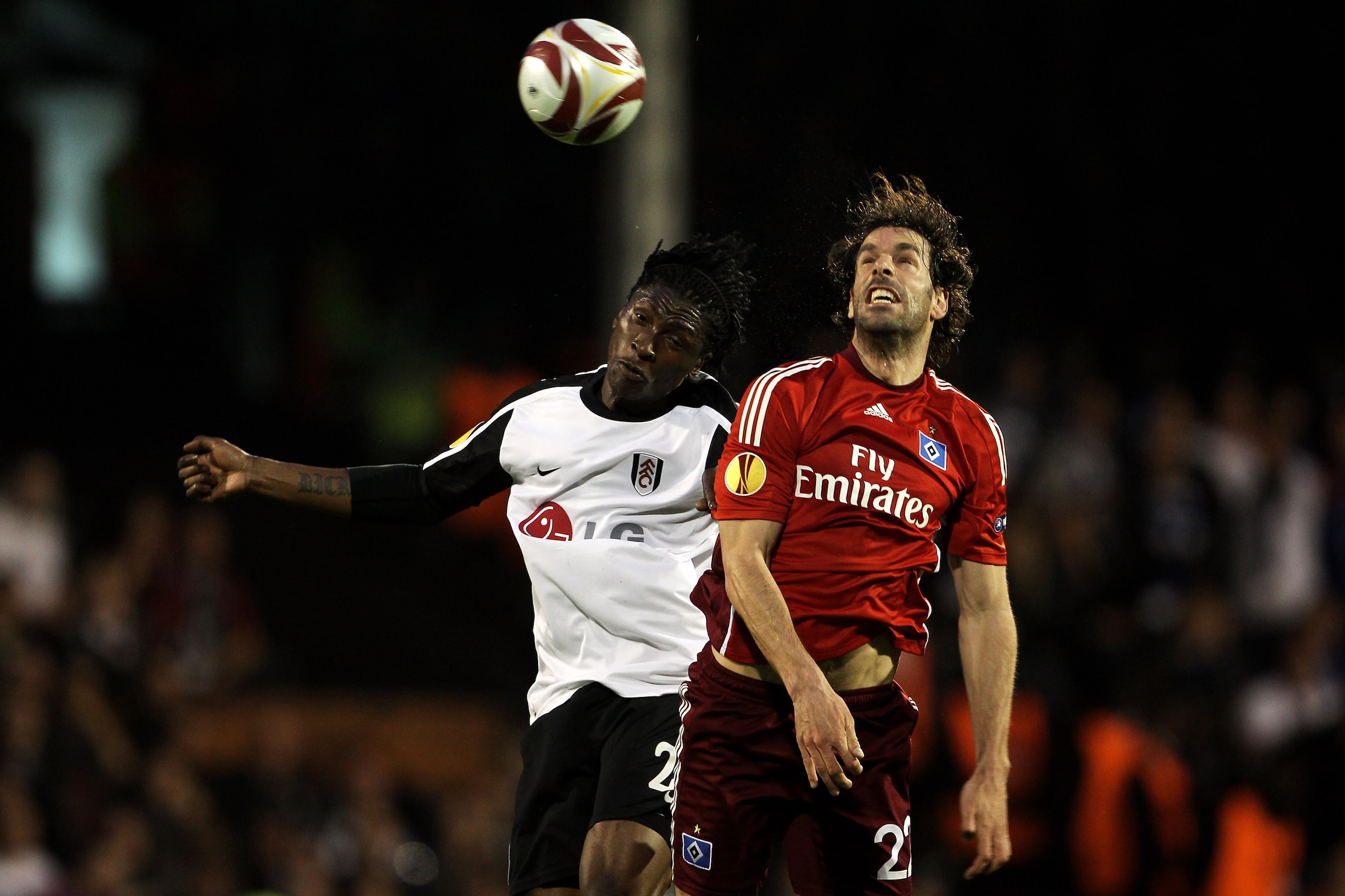 LONDON, ENGLAND - APRIL 29: Dickson Etuhu of Fulham battles for the header with Ruud van Nistelrooy of Hamburg during the UEFA Europa League Semi-Final 2nd leg match between Fulham and Hamburger SV at Craven Cottage on April 29, 2010 in London, England. LONDON, ENGLAND - APRIL 29: Dickson Etuhu of Fulham battles for the header with Ruud van Nistelrooy of Hamburg during the UEFA Europa League Semi-Final 2nd leg match between Fulham and Hamburger SV at Craven Cottage on April 29, 2010 in London, England.