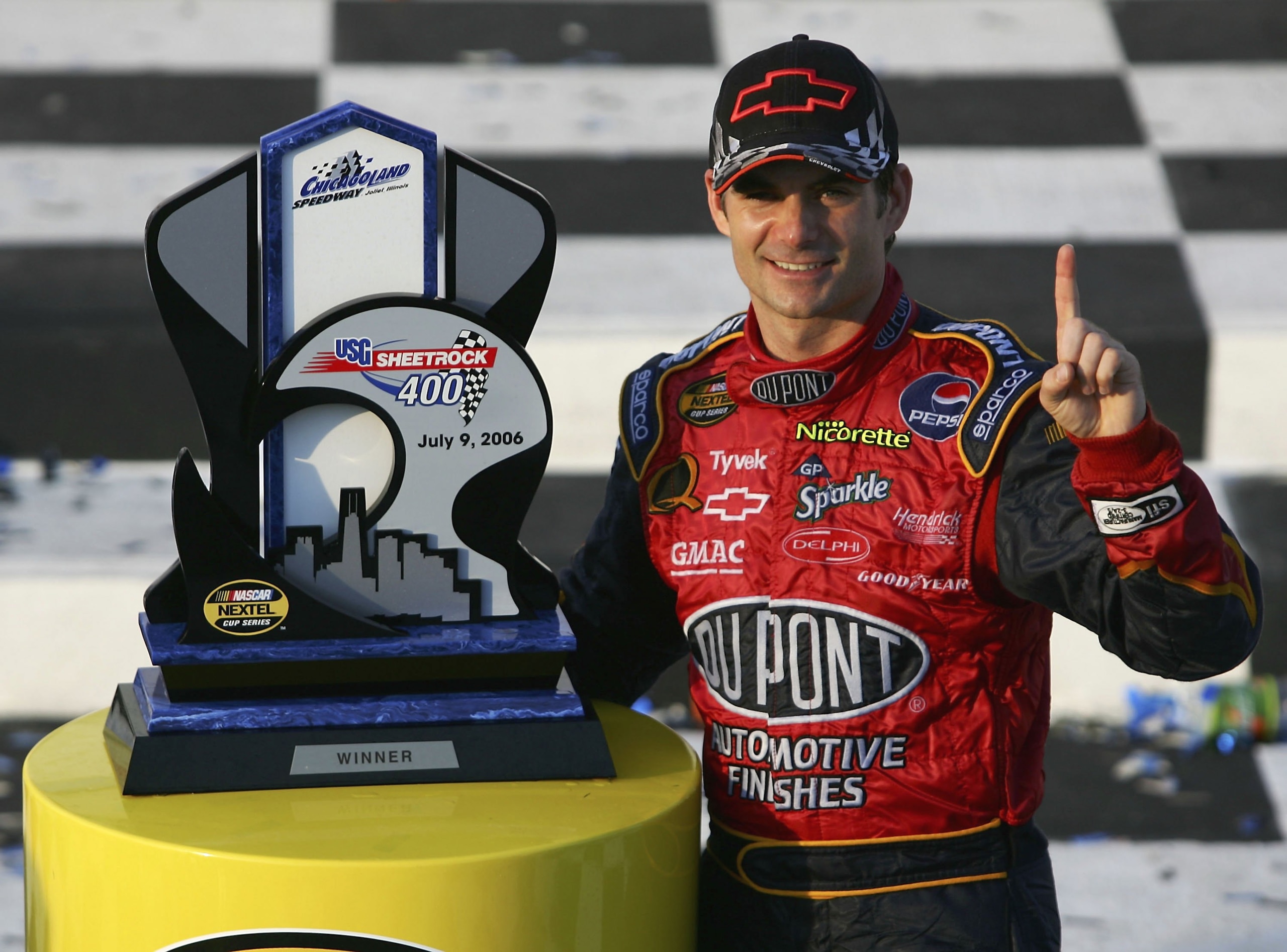 JOLIET, IL - JULY 09:  Jeff Gordon, driver of the #24 DuPont Chevrolet, poses in victory lane after winning the NASCAR Nextel Cup Series USG Sheetrock 400 on July 9, 2006 at Chicagoland Speedway in Joliet, Illinois.  (Photo by Harry How/Getty Images for N