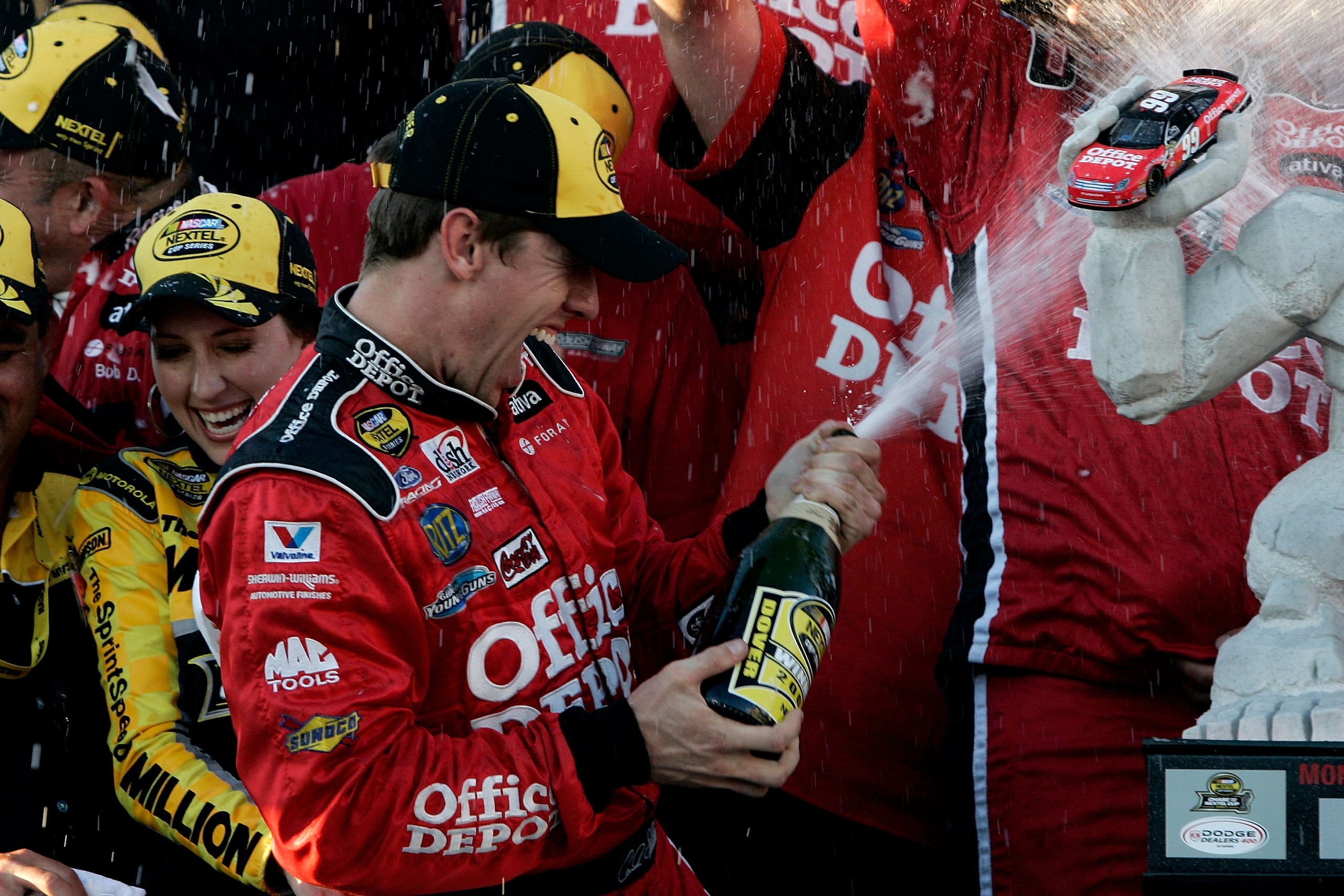 DOVER, DE - SEPTEMBER 23:  Carl Edwards, driver of the #99 Office Depot Ford, celebrates with his crew members in victory lane after winning the NASCAR Nextel Cup Series Dodge Dealers 400 at Dover International Speedway on September 23, 2007 in Dover, Del