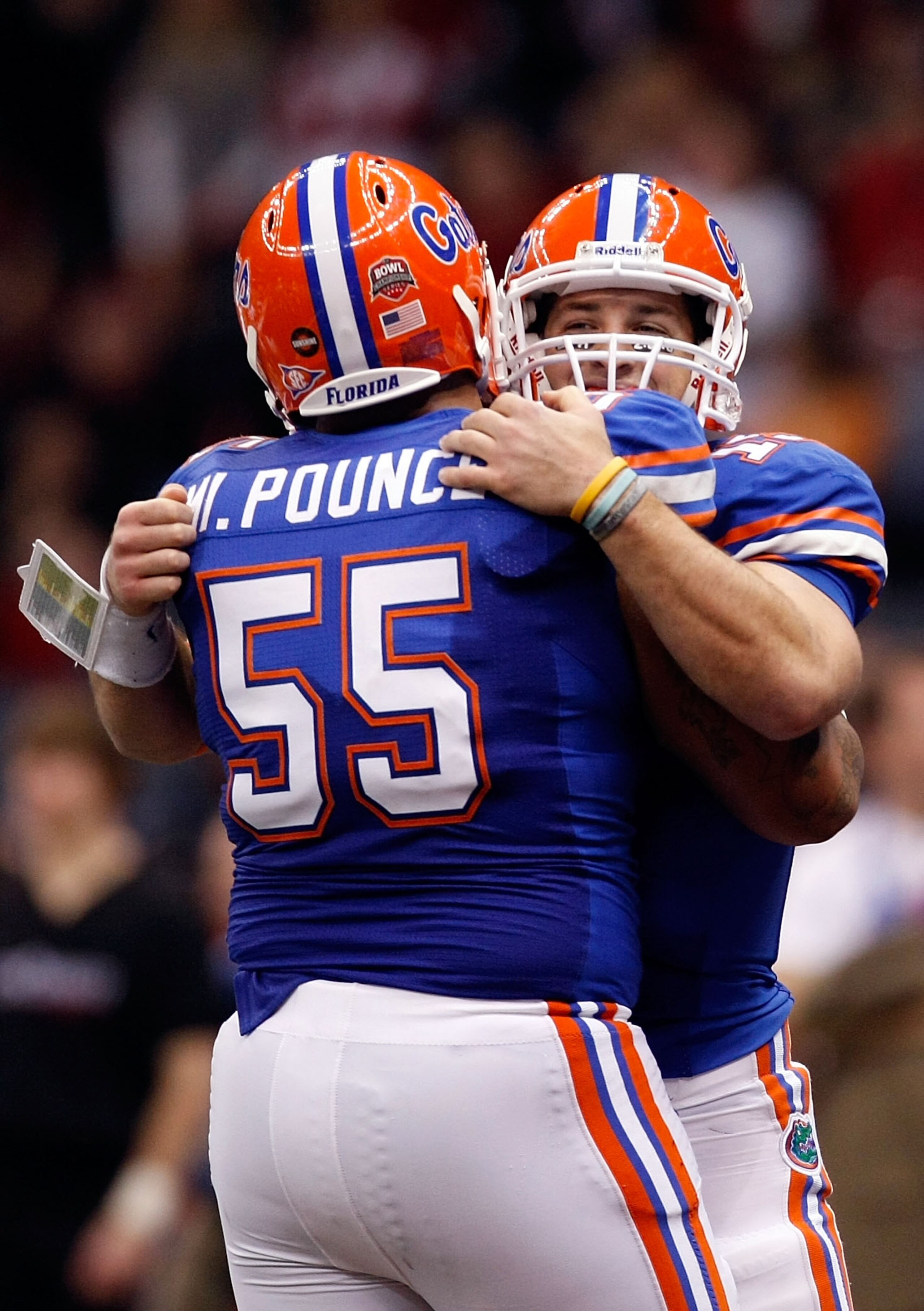 NEW ORLEANS - JANUARY 01:  Tim Tebow #15 of the Florida Gators hugs teammate Mike Pouncey #55 after scoring a touchdown against the Cincinnati Bearcats during the Allstate Sugar Bowl at the Louisana Superdome on January 1, 2010 in New Orleans, Louisiana. 