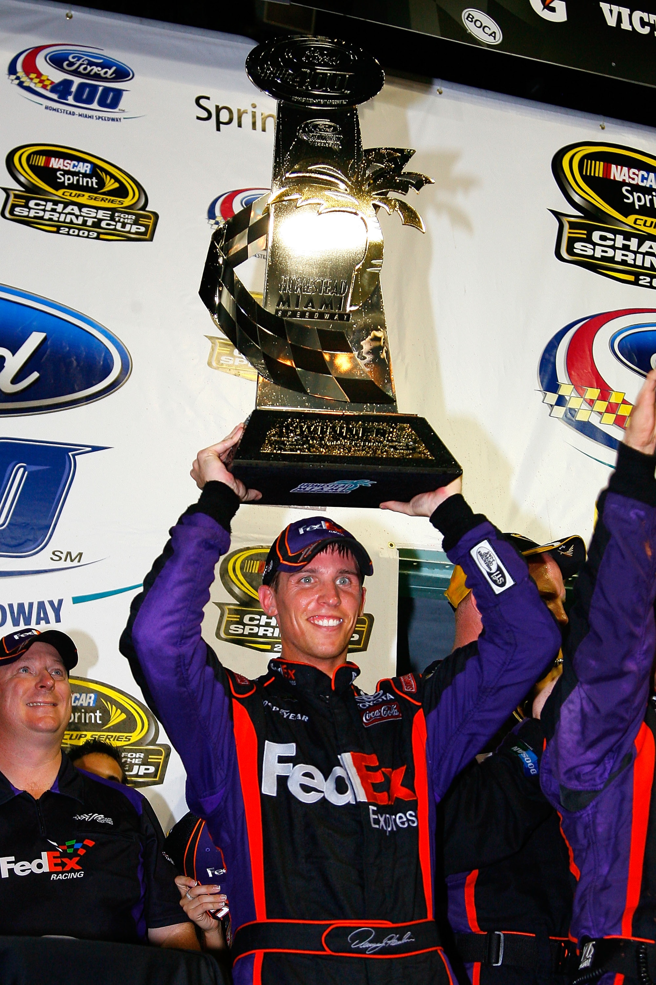 HOMESTEAD, FL - NOVEMBER 22:  Denny Hamlin, driver of the #11 FedEx Express Toyota, celebrates in victory lane after winning the NASCAR Sprint Cup Series Ford 400 at Homestead-Miami Speedway on November 22, 2009 in Homestead, Florida.  (Photo by Jason Smi