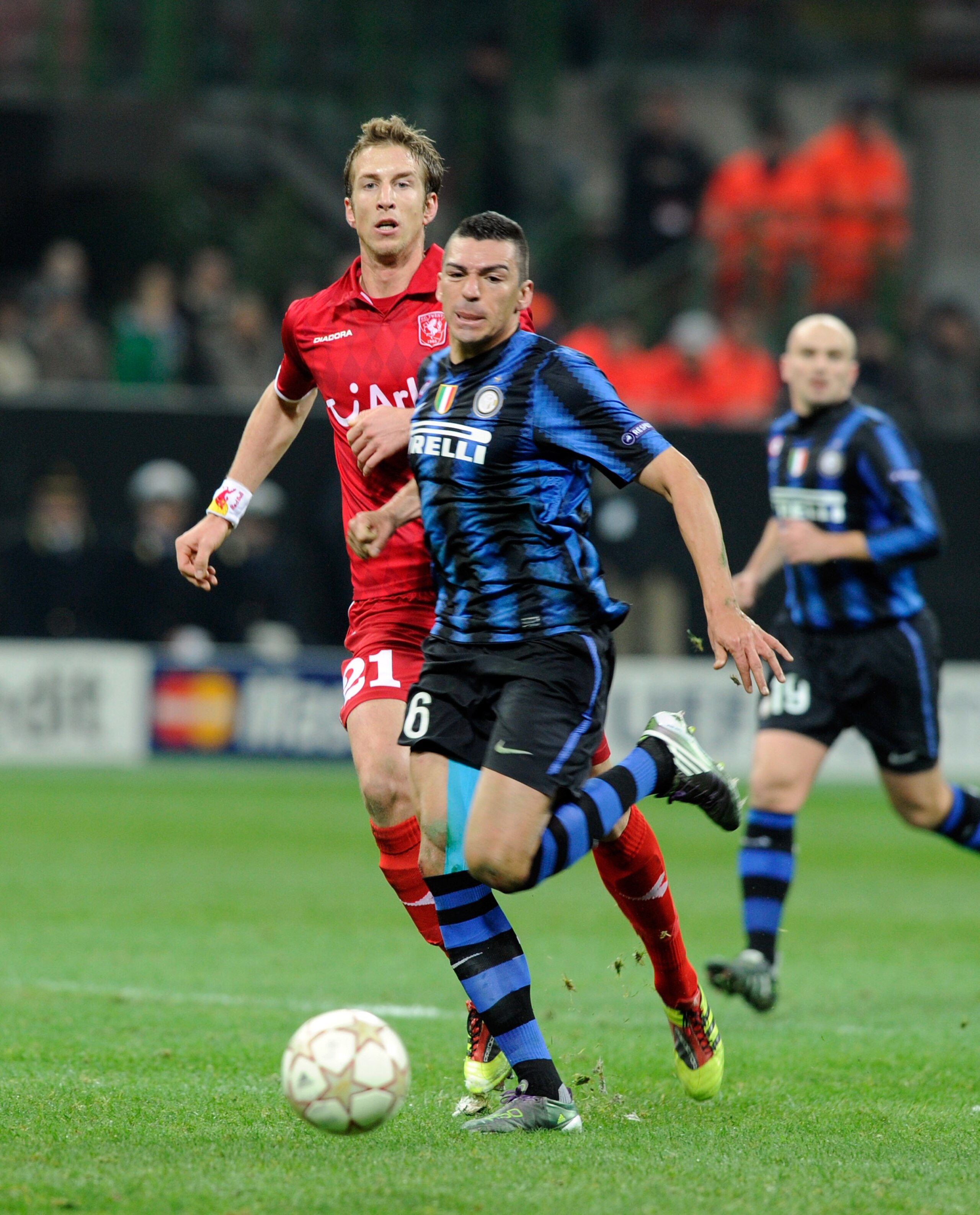 MILAN, ITALY - NOVEMBER 24:  Lucio of FC Internazionale Milano and Luuk de Jong of FC Twente compete for the ball during the UEFA Champions League Group A match between FC Internazionale Milano and FC Twente at Stadio Giuseppe Meazza on November 24, 2010
