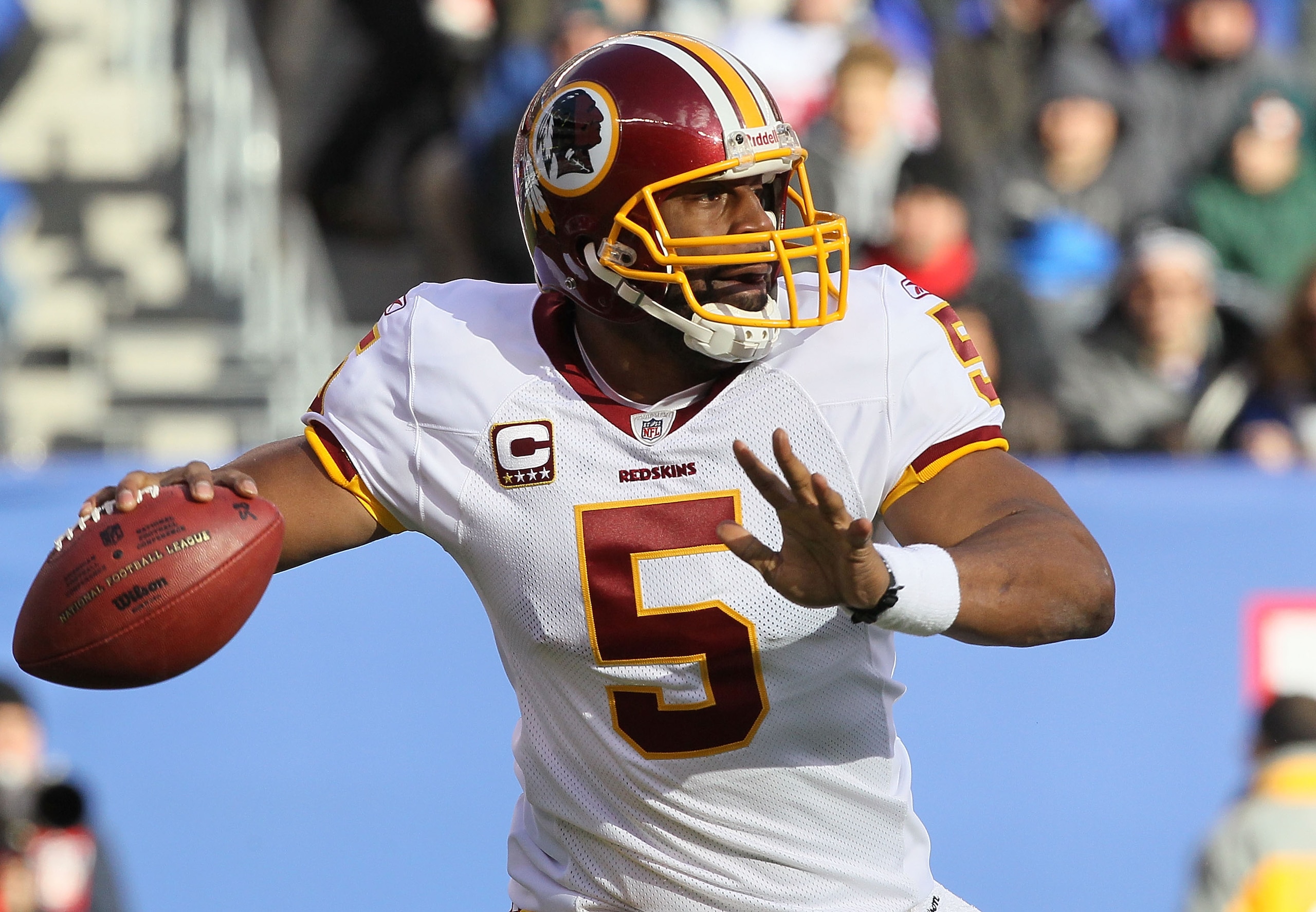 EAST RUTHERFORD, NJ - DECEMBER 05:  Donovan McNabb #5 of the Washington Redskins throws a pass against the New York Giants on December 5, 2010 at the New Meadowlands Stadium in East Rutherford, New Jersey. The Giants defeated the Redskins 31-7.  (Photo by