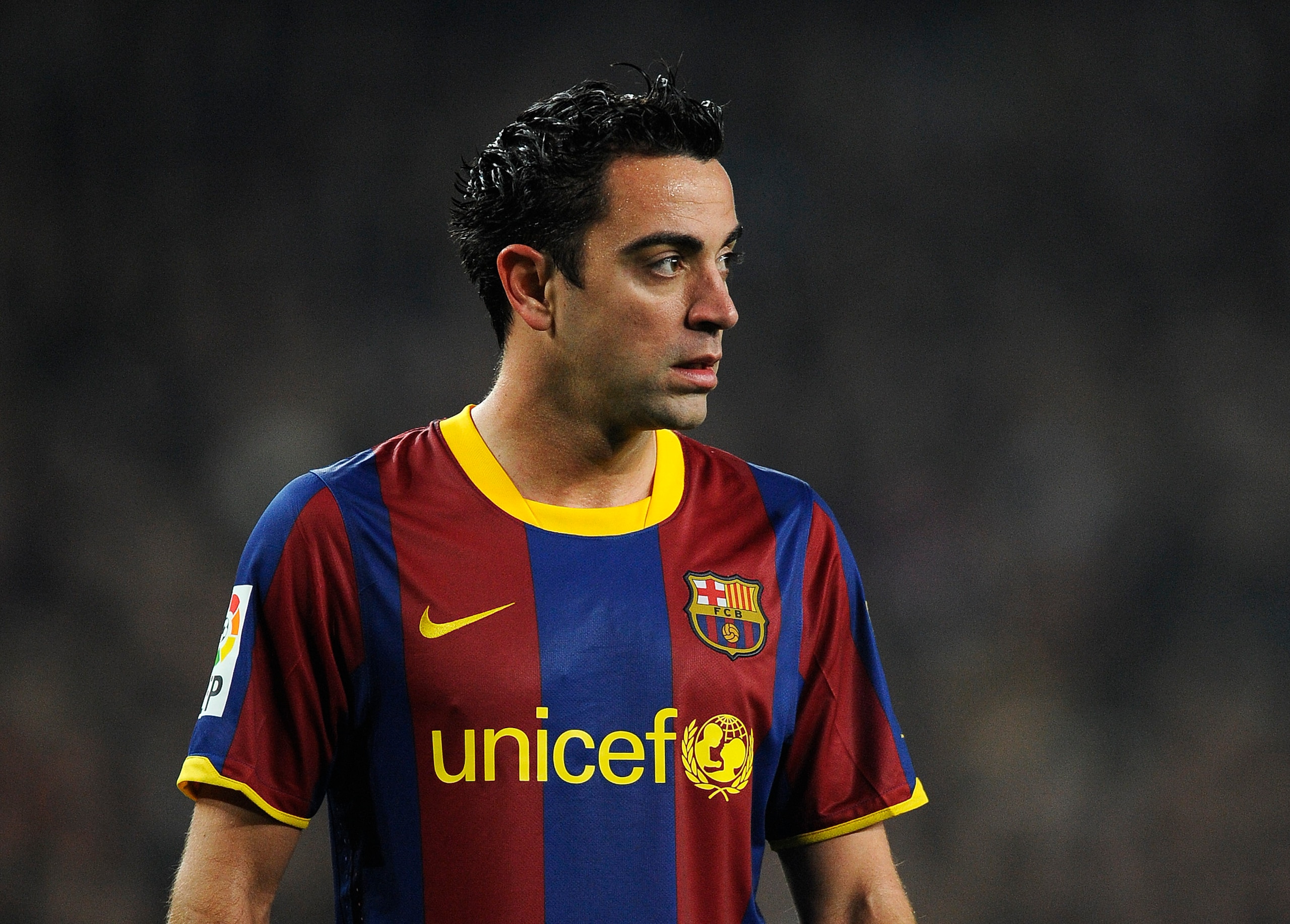 BARCELONA, SPAIN - JANUARY 16:  Xavi Hernandez of FC Barcelona looks on during the La Liga match between FC Barcelona and Malaga at Nou Camp on January 16, 2011 in Barcelona, Spain. Barcelona won 4-1.  (Photo by David Ramos/Getty Images)