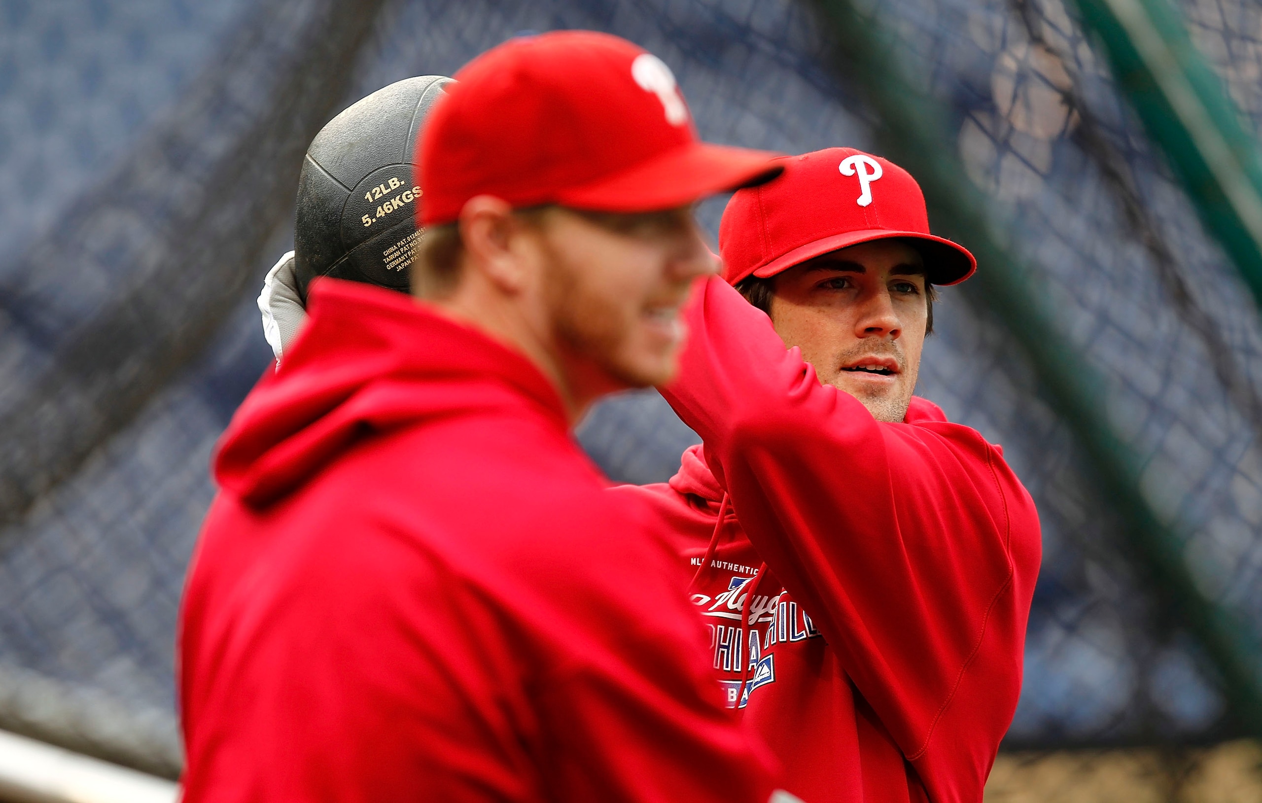 PHILADELPHIA - OCTOBER 15:  Cole Hamels #35 and Roy Halladay #34 of the Philadelphia Phillies stretch during a workout before the NLCS against the San Francisco Giants at Citizens Bank Park on October 15, 2010 in Philadelphia, Pennsylvania.  (Photo by Jef