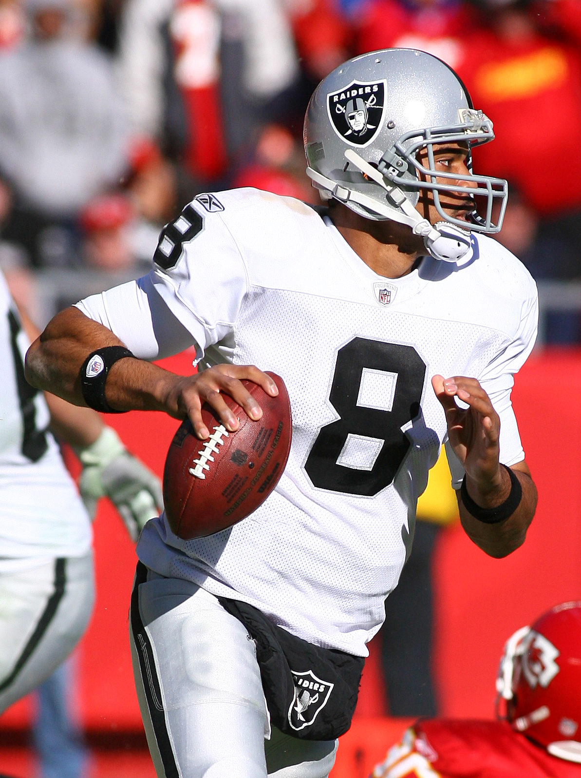 Oakland Raiders quarterback Jason Campbell (8) talks with offensive  coordinator Hue Jackson, left, against the San