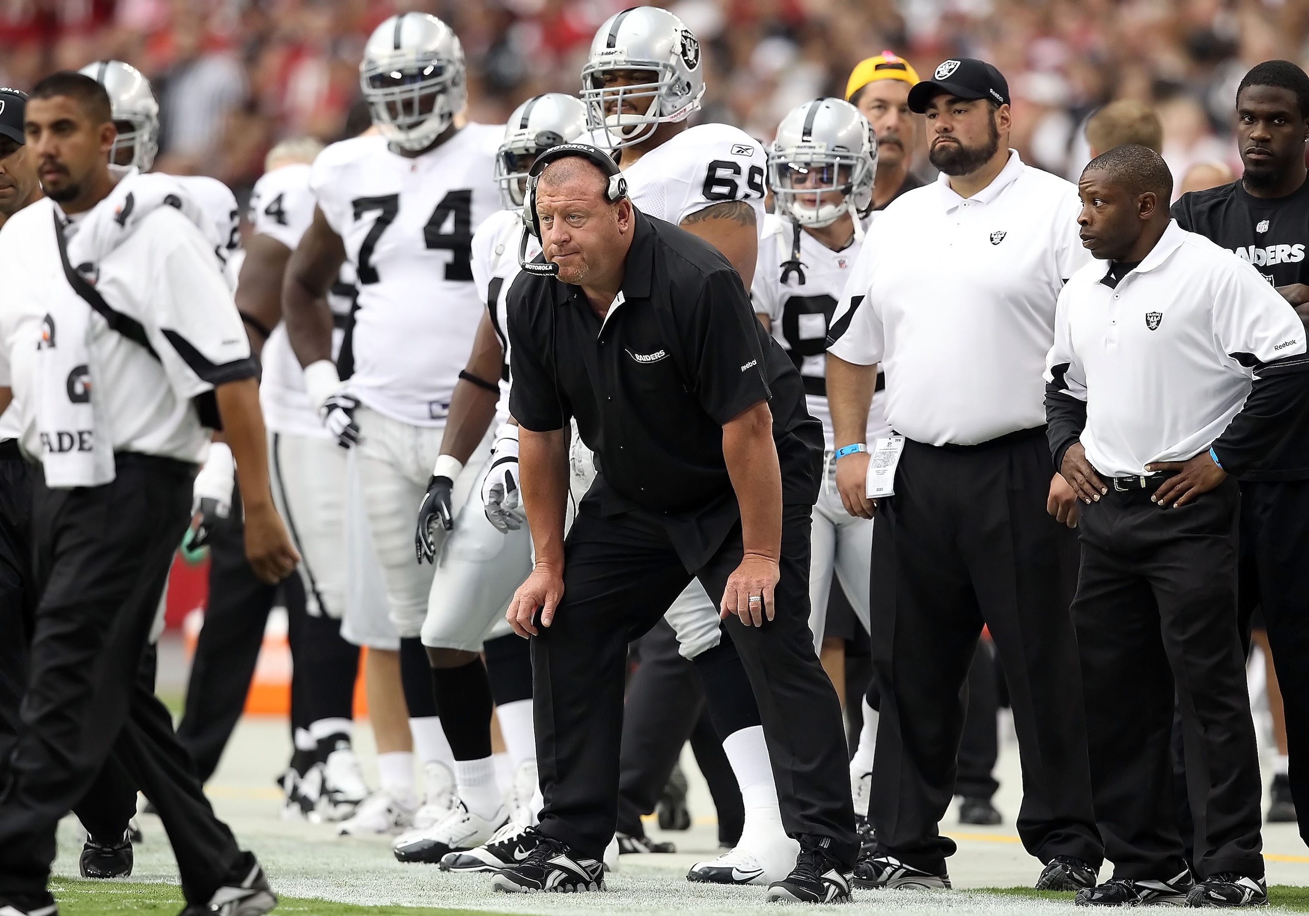 GLENDALE, AZ - SEPTEMBER 26:  Head coach Tom Cable of the Oakland Raiders watches from the sidelines during the NFL game against the Arizona Cardinals at the University of Phoenix Stadium on September 26, 2010 in Glendale, Arizona.  (Photo by Christian Pe