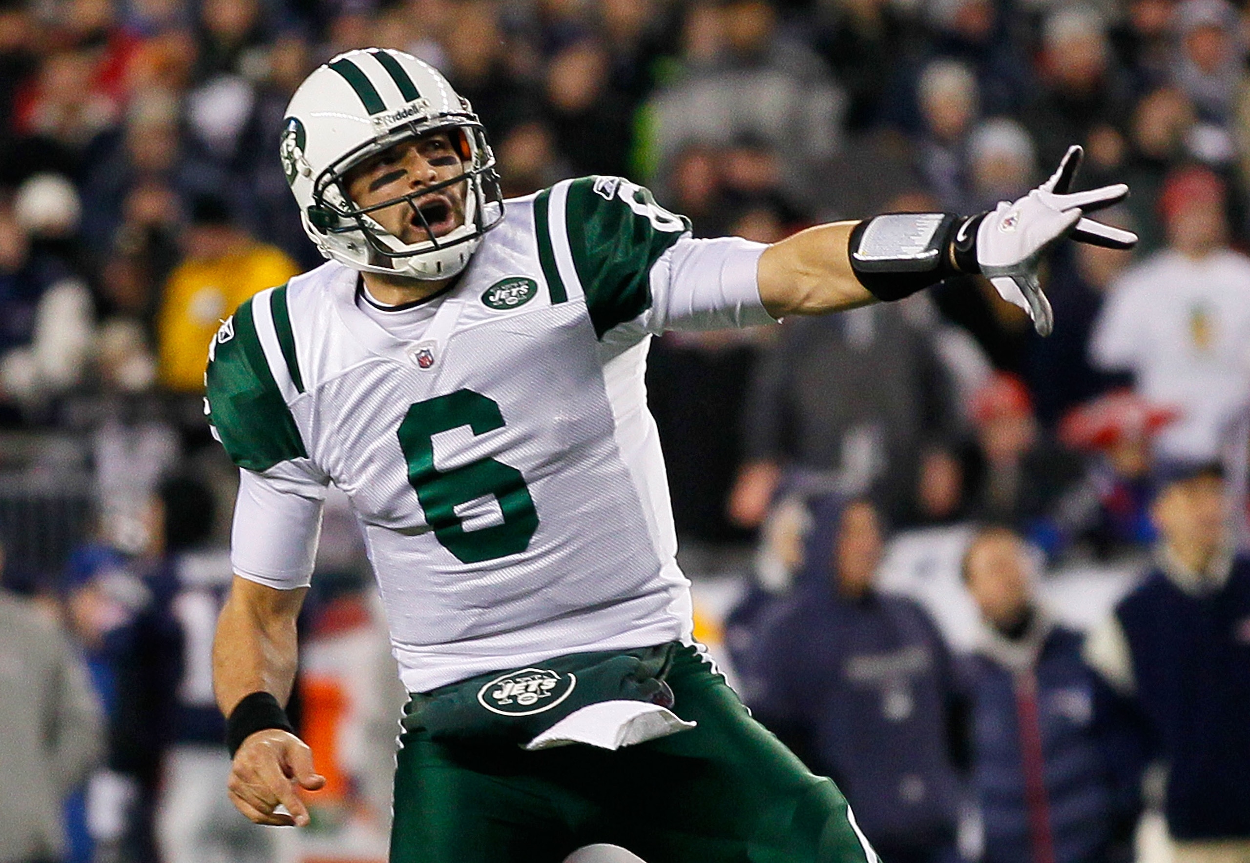 FOXBORO, MA - JANUARY 16:  Mark Sanchez #6 of the New York Jets celebrates a second quarter touchdown during their 2011 AFC divisional playoff game against the New England Patriots at Gillette Stadium on January 16, 2011 in Foxboro, Massachusetts.  (Photo