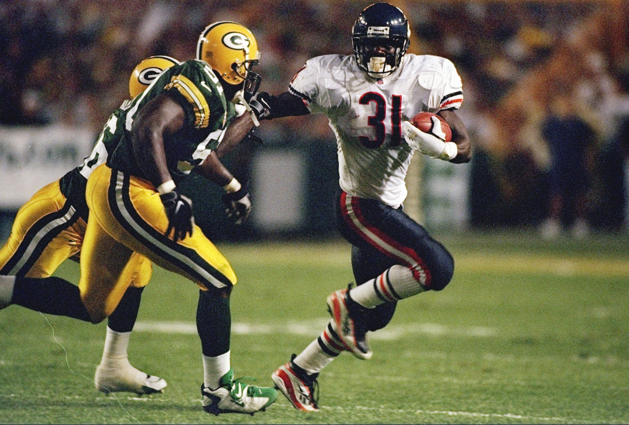 1 Sep 1997:  Running back Rashaan Salaam #31 of the Chicago Bears tries to run around Brian Williams #51 of the Green Bay Packers during the Bears 38-24 loss at Lambeau Field in Green Bay, Wisconsin. Mandatory Credit: Jonathan Daniel  /Allsport