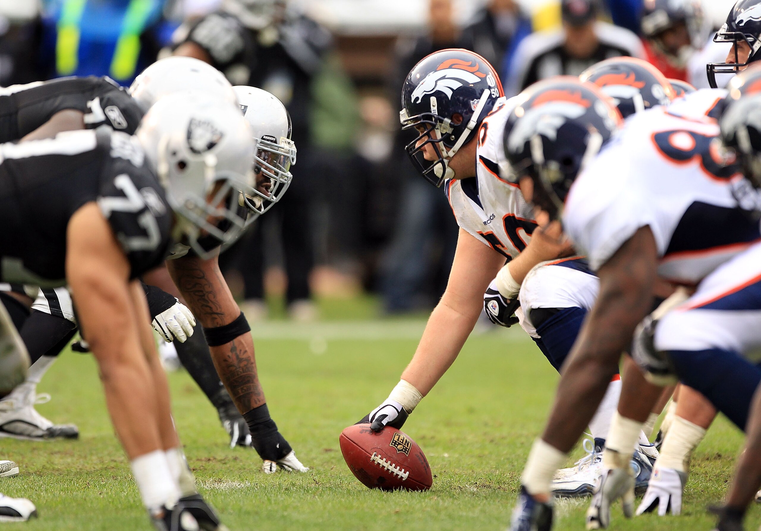 OAKLAND, CA - DECEMBER 19:  J.D. Walton #50 of the Denver Broncos lines up against the Oakland Raiders at Oakland-Alameda County Coliseum on December 19, 2010 in Oakland, California.  (Photo by Ezra Shaw/Getty Images)