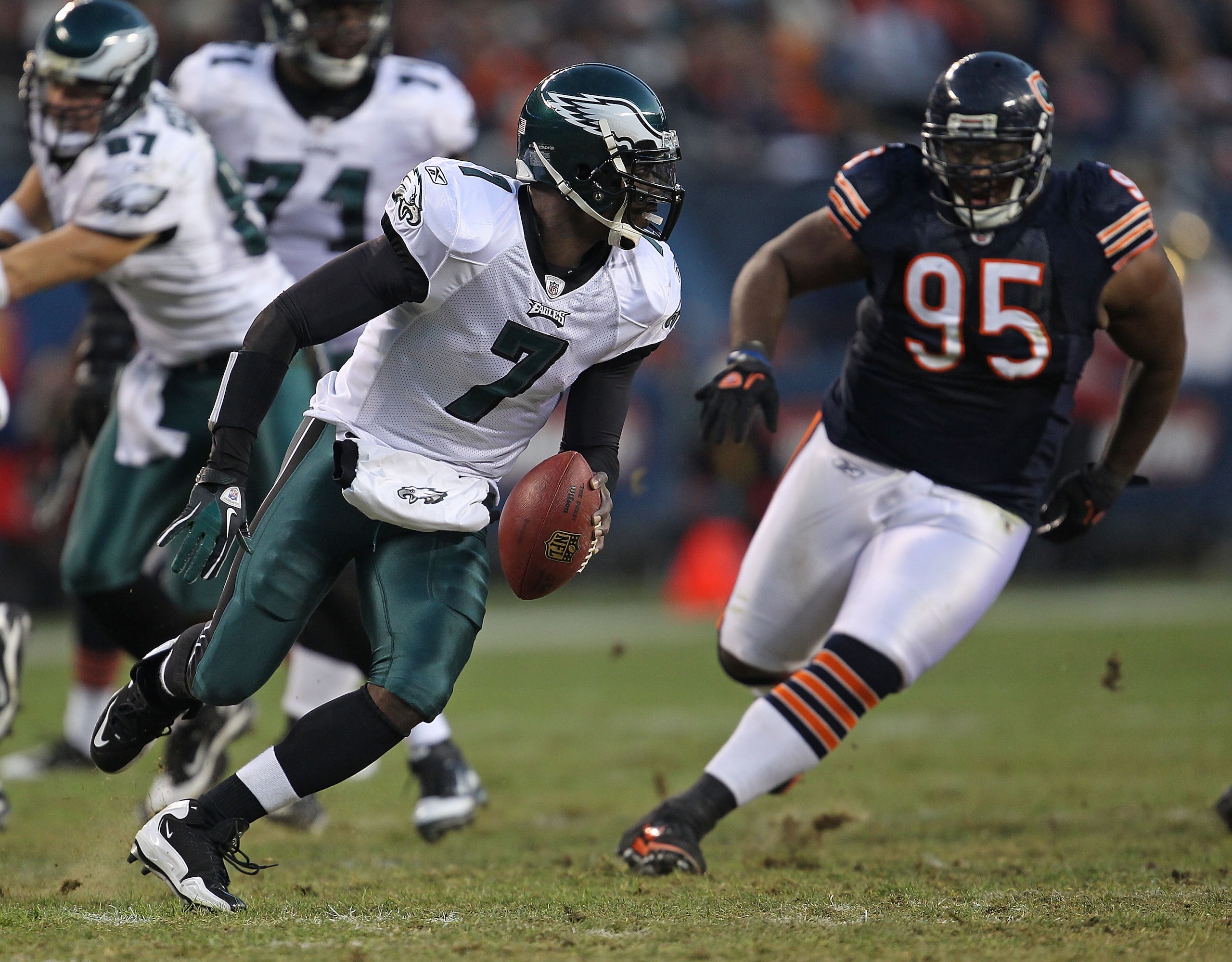 CHICAGO - NOVEMBER 28: Michael Vick #7 of the Philadelphia Eagles runs to avoid Anthony Adams #95 of the Chicago Bears at Soldier Field on November 28, 2010 in Chicago, Illinois. The Bears defeated the Eagles 31-26. (Photo by Jonathan Daniel/Getty Images) CHICAGO - NOVEMBER 28: Michael Vick #7 of the Philadelphia Eagles runs to avoid Anthony Adams #95 of the Chicago Bears at Soldier Field on November 28, 2010 in Chicago, Illinois. The Bears defeated the Eagles 31-26. (Photo by Jonathan Daniel/Getty Images)