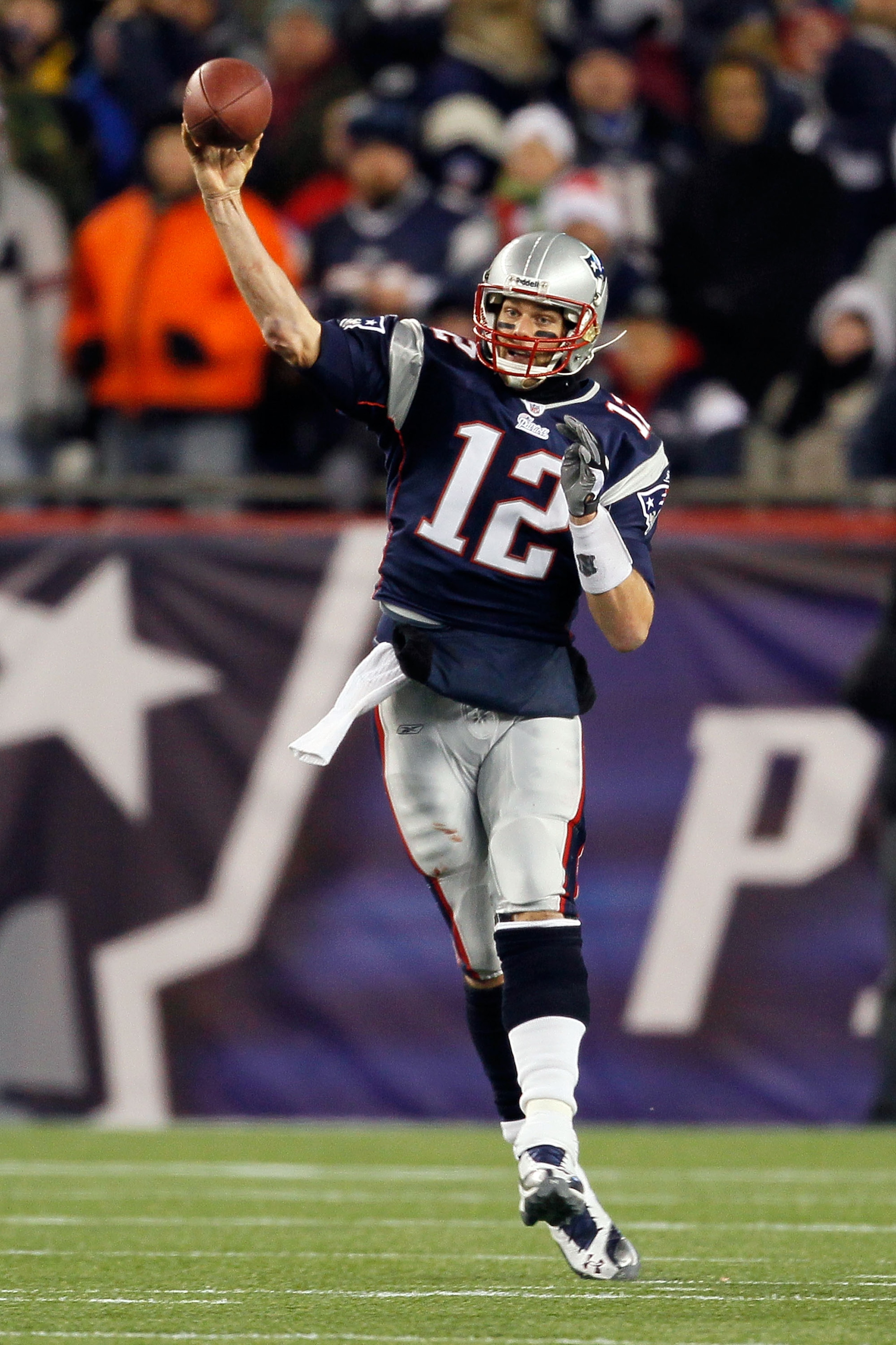 FOXBORO, MA - DECEMBER 06:  Tom Brady #12 of the New England Patriots throws a pass against the New York Jets at Gillette Stadium on December 6, 2010 in Foxboro, Massachusetts.  (Photo by Jim Rogash/Getty Images)