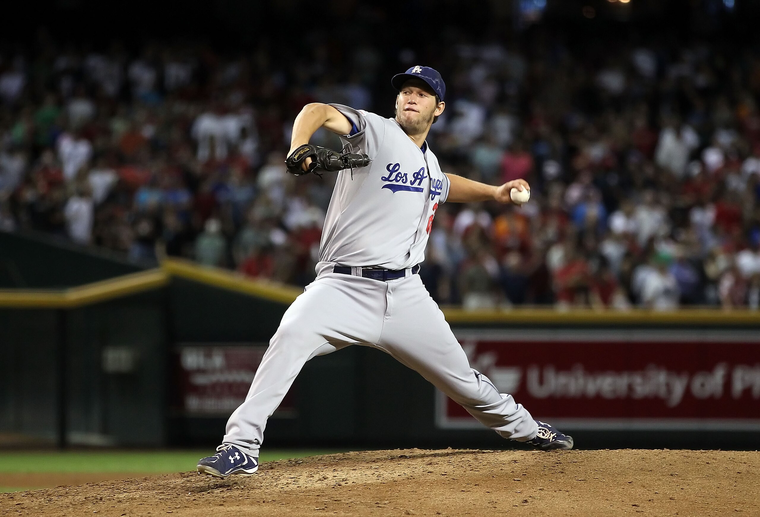 PHOENIX - SEPTEMBER 24:  Starting pitcher Clayton Kershaw #22 of the Los Angeles Dodgers pitches against the Arizona Diamondbacks during the Major League Baseball game at Chase Field on September 24, 2010 in Phoenix, Arizona.  (Photo by Christian Petersen