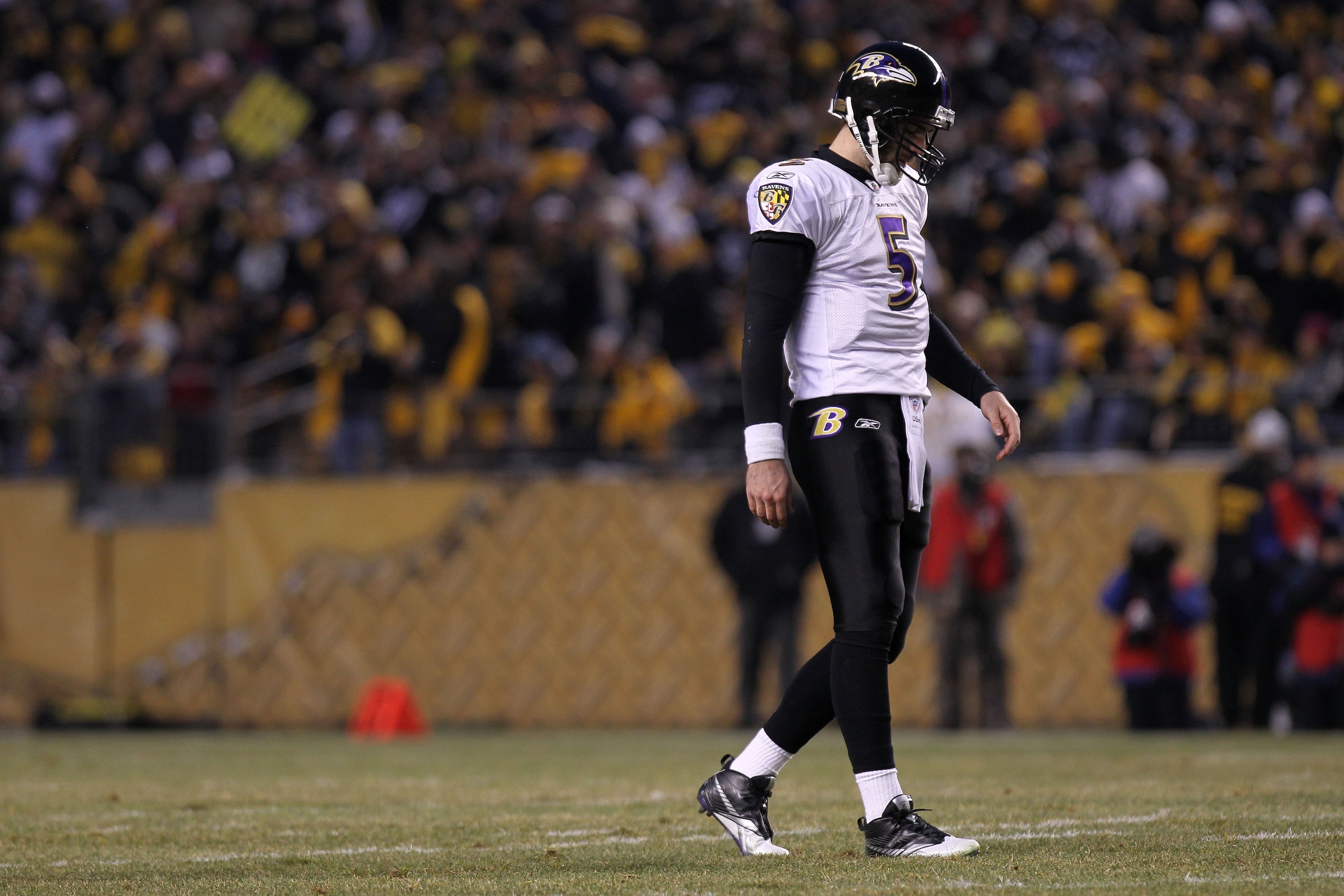 PITTSBURGH, PA - JANUARY 15:  Quarterback Joe Flacco #5 of the Baltimore Ravens walks off the field against the Pittsburgh Steelers in the AFC Divisional Playoff Game at Heinz Field on January 15, 2011 in Pittsburgh, Pennsylvania.  (Photo by Nick Laham/Ge