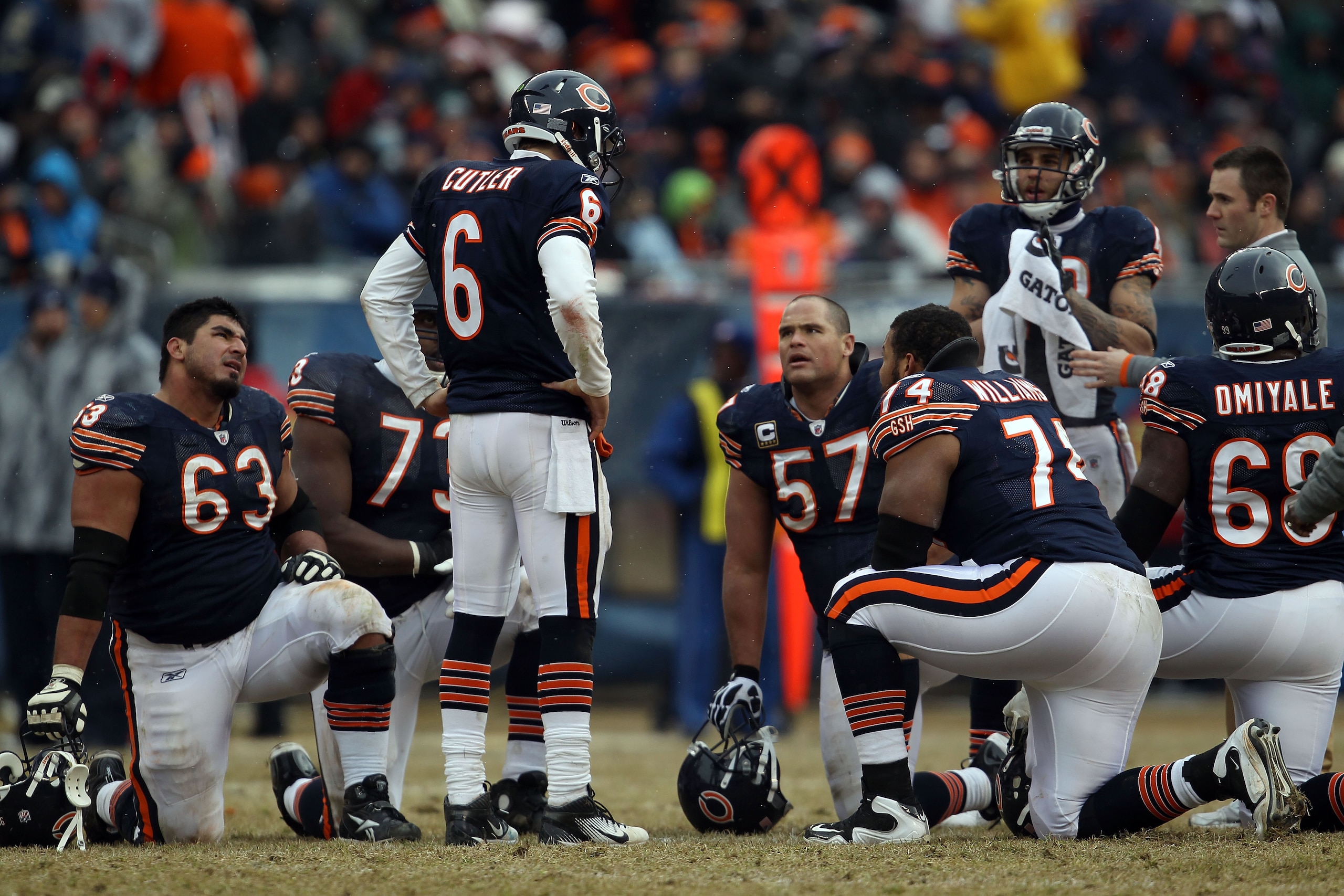 CHICAGO, IL - JANUARY 16:  Quarterback Jay Cutler #6 of the Chicago Bears talks with his offense as Marcus Trufant #23 of the Seattle Seahawks is injured on the field in the second half against the Seattle Seahawks in the 2011 NFC divisional playoff game