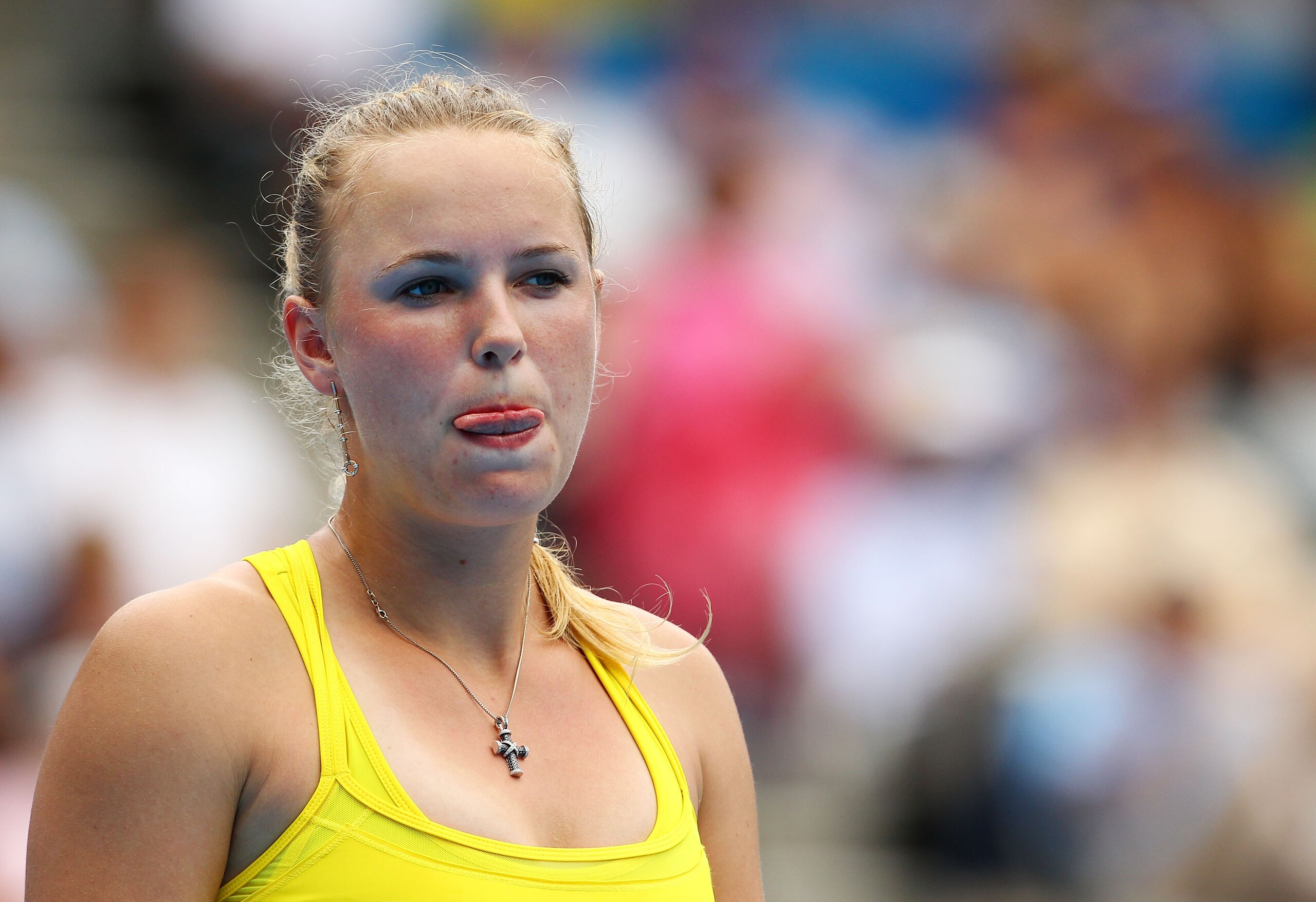 SYDNEY, AUSTRALIA - JANUARY 11:  Caroline Wozniacki of Denmark reacts after a point in her match against Dominika Cibulkova of Slovakia during day three of the 2011 Medibank International at Sydney Olympic Park Tennis Centre on January 11, 2011 in Sydney,