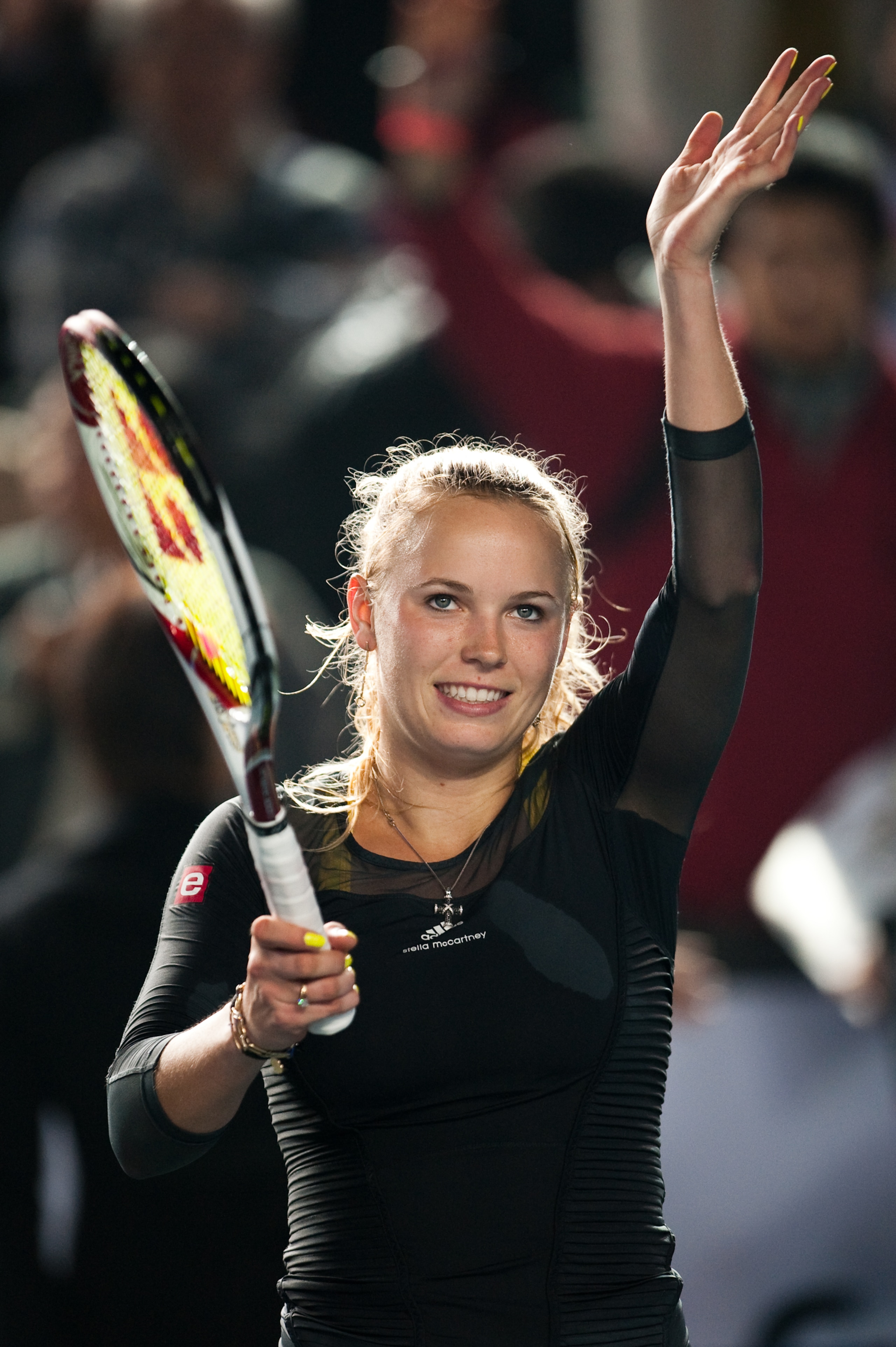 HONG KONG - JANUARY 05:  Caroline Wozniacki of Denmark greets the crowd after winning her match against Li Na of China during day one of the Hong Kong Tennis Classic 2011 on January 5, 2011 in Hong Kong, China.  (Photo by Victor Fraile/Getty Images)