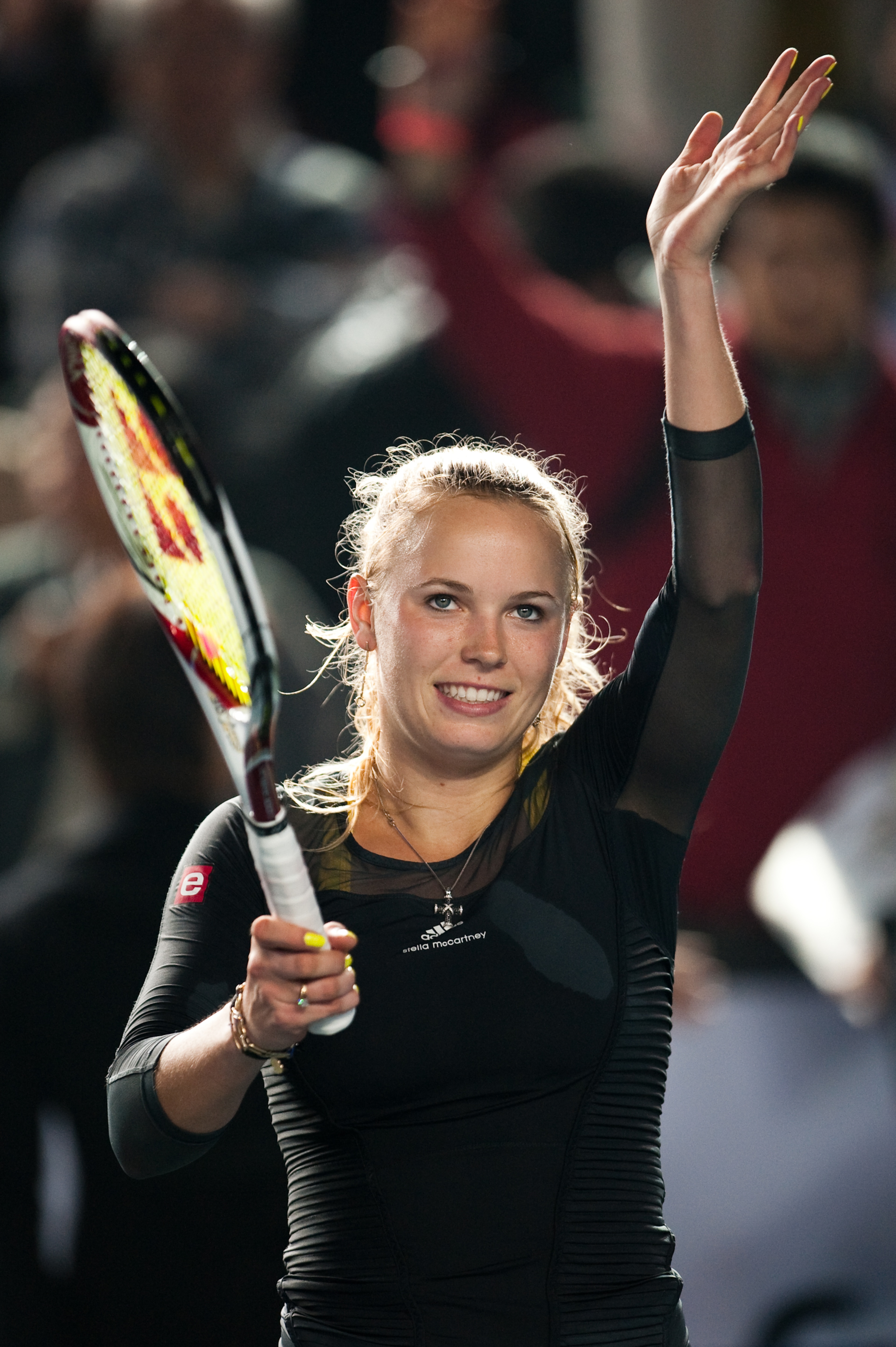 HONG KONG - JANUARY 05:  Caroline Wozniacki of Denmark greets the crowd after winning her match against Li Na of China during day one of the Hong Kong Tennis Classic 2011 on January 5, 2011 in Hong Kong, China.  (Photo by Victor Fraile/Getty Images)