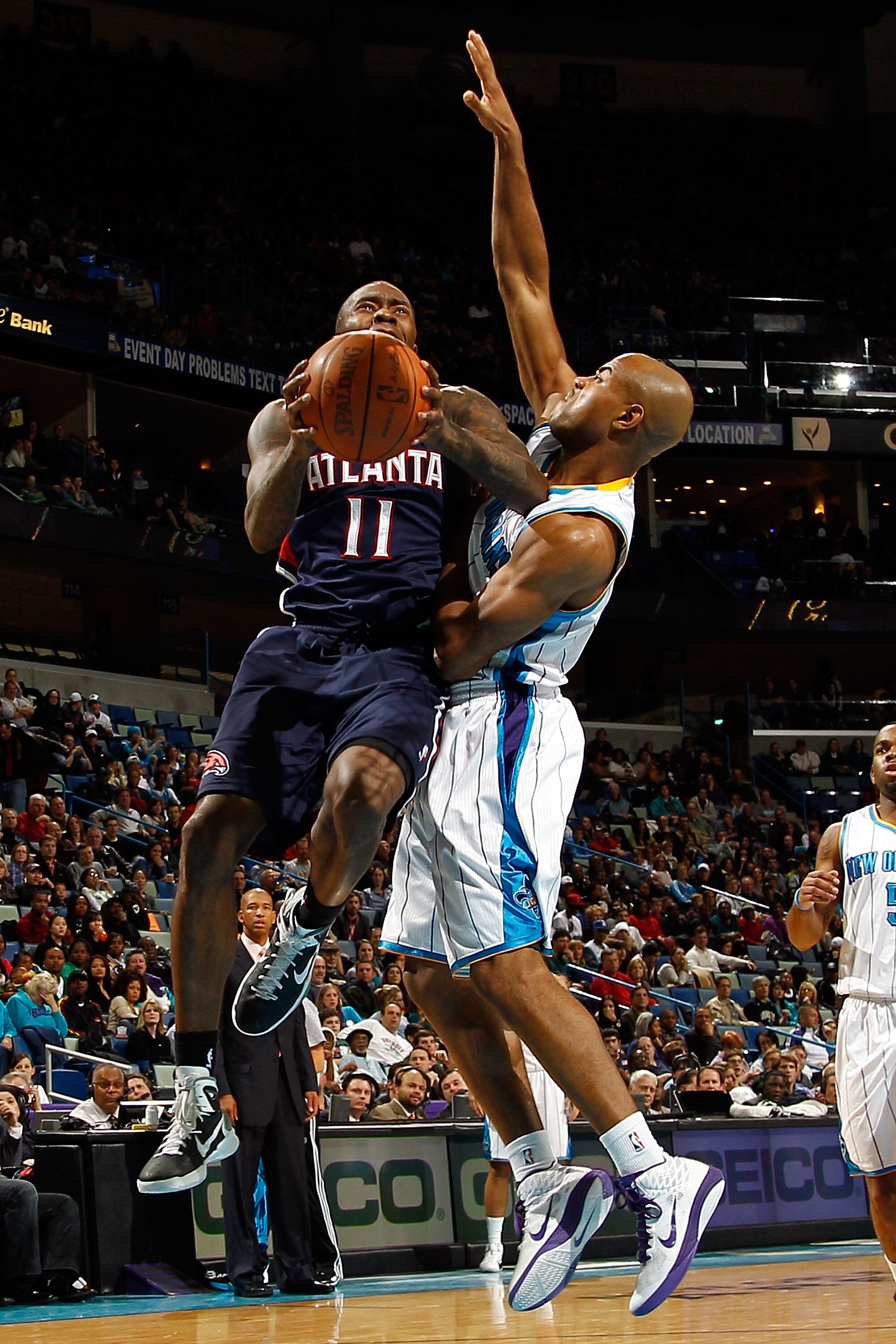 NEW ORLEANS, LA - DECEMBER 26:  Jamal Crawford #11 of the Atlanta Hawks shoots the ball over Jarrett Jack #2 of the New Orleans Hornets at the New Orleans Arena on December 26, 2010 in New Orleans, Louisiana.  The Hornets defeated the Hawks 93-86.  NOTE T