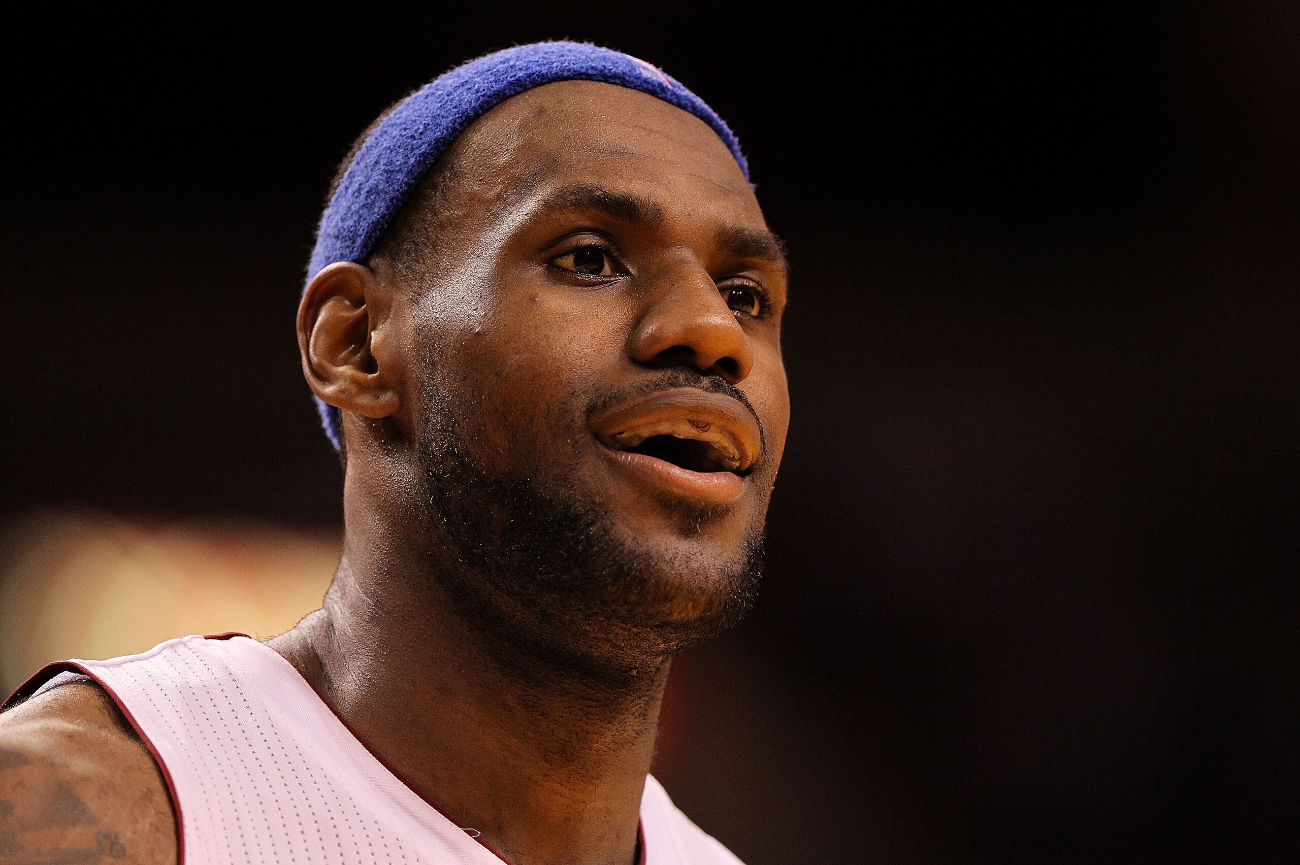 MIAMI, FL - JANUARY 04:  LeBron James #6 of the Miami Heat smiles during a timeout during a game against the Milwaukee Bucks at American Airlines Arena on January 4, 2011 in Miami, Florida. NOTE TO USER: User expressly acknowledges and agrees that, by dow