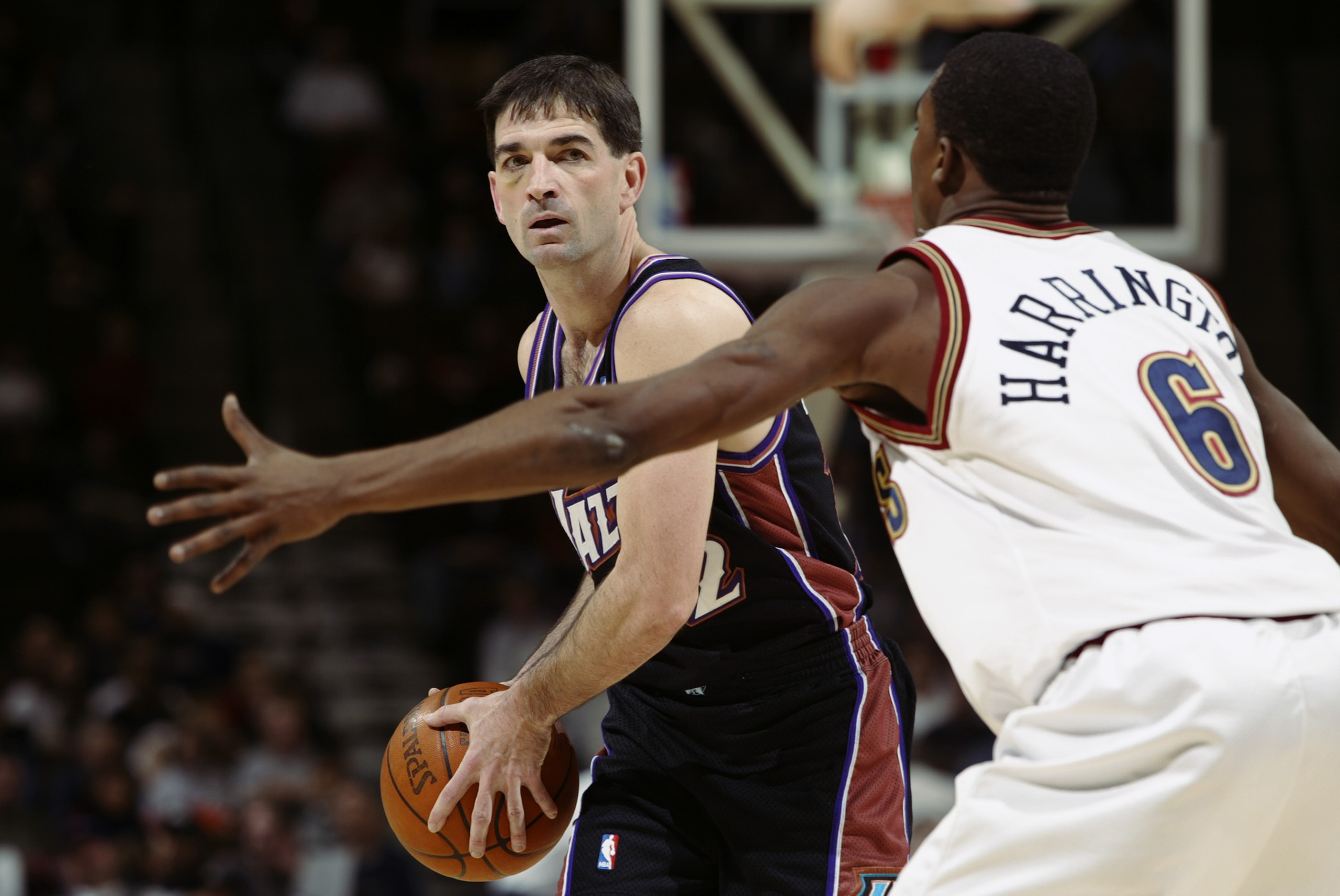 DENVER - JANUARY 15:  John Stockton #12 of the Utah Jazz is defended by Junior Harrington #6 of the Denver Nuggets during the game at Pepsi Center on January 15 2003 in Denver, Colorado.  The Jazz won 92-81.  NOTE TO USER:  User expressly acknowledges and