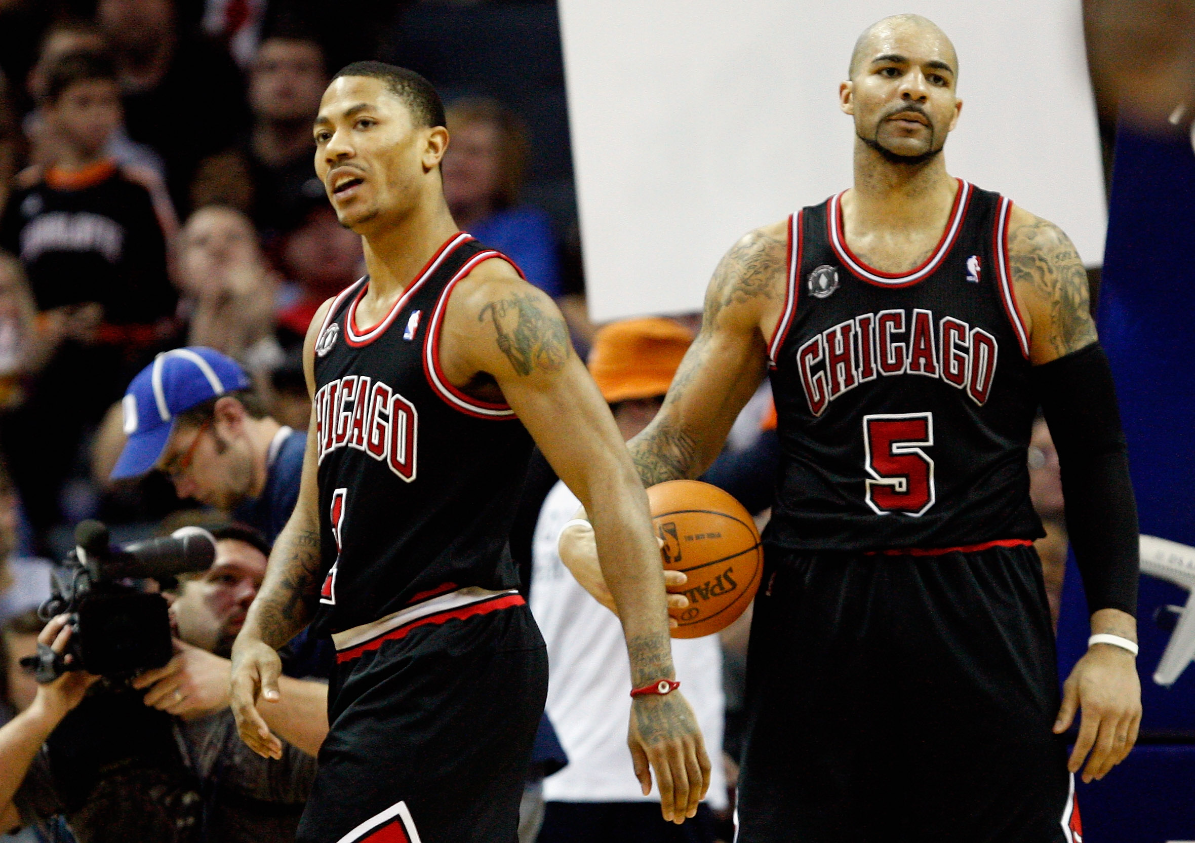 CHARLOTTE, NC - JANUARY 12:  Teammates Derrick Rose #1 and Carlos Boozer #5 of the Chicago Bulls reacts after a  play against the Charlotte Bobcats during their game at Time Warner Cable Arena on January 12, 2011 in Charlotte, North Carolina. NOTE TO USER