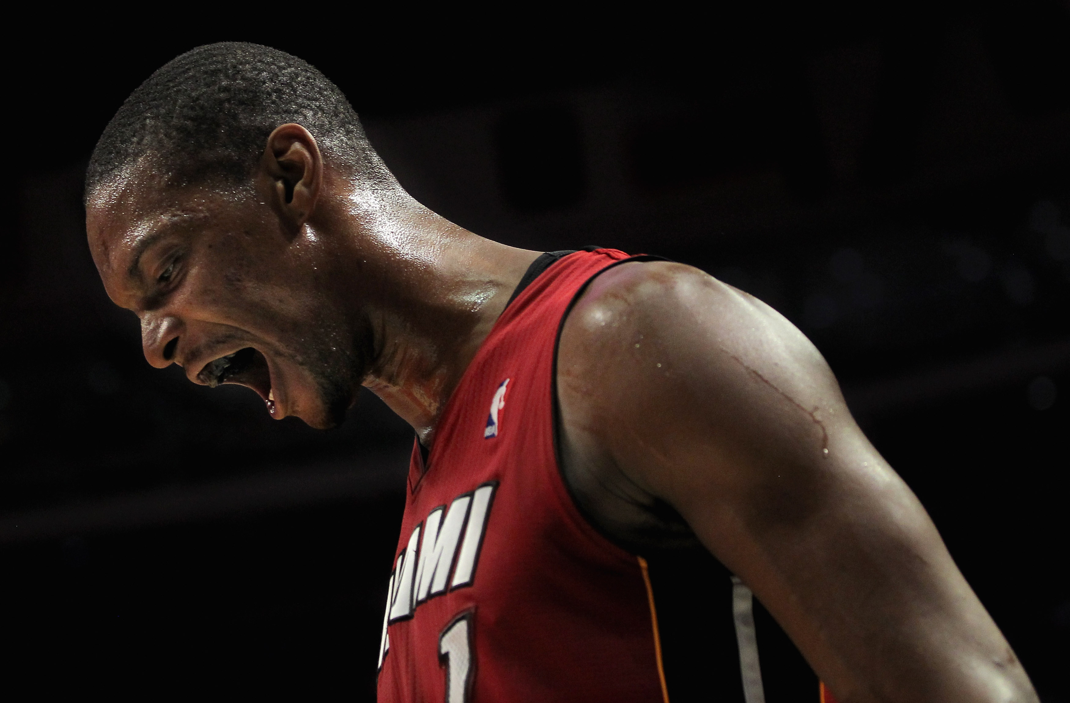 CHICAGO, IL - JANUARY 15:  Chris Bosh #1 of the Miami Heat reacts after a play against the Chicago Bulls at the United Center on January 15, 2011 in Chicago, Illinois. The Bulls defeated the Heat 99-96. NOTE TO USER: User expressly acknowledges and agrees