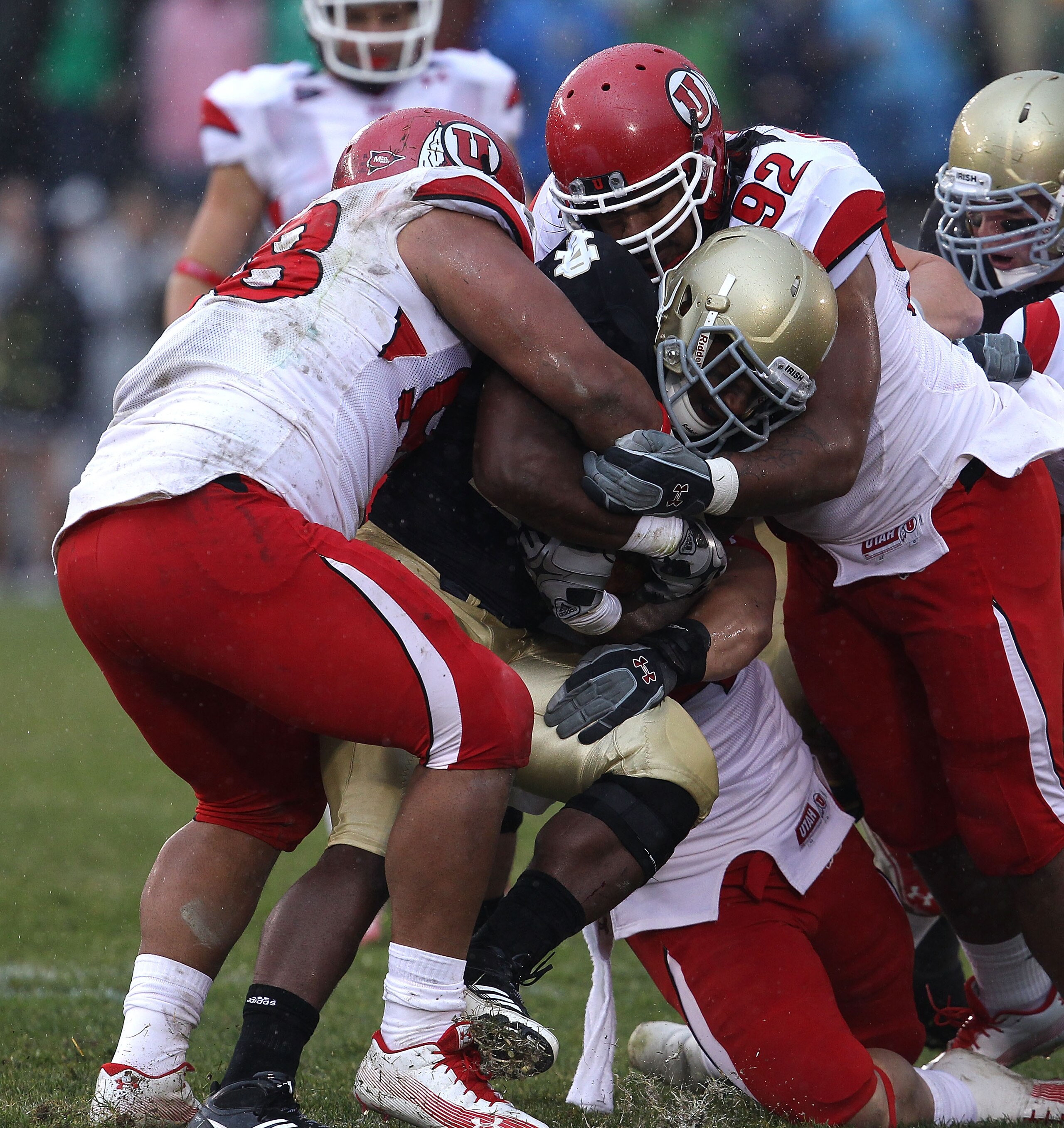 SOUTH BEND, IN - NOVEMBER 13: Sealver Siliga #98 and Star Lotulelei #92 of the Utah Utes stop Jonas Gray #25 of the Notre Dame Fighting Irish at Notre Dame Stadium on November 13, 2010 in South Bend, Indiana. Notre Dame defeated Utah 28-3. (Photo by Jonat