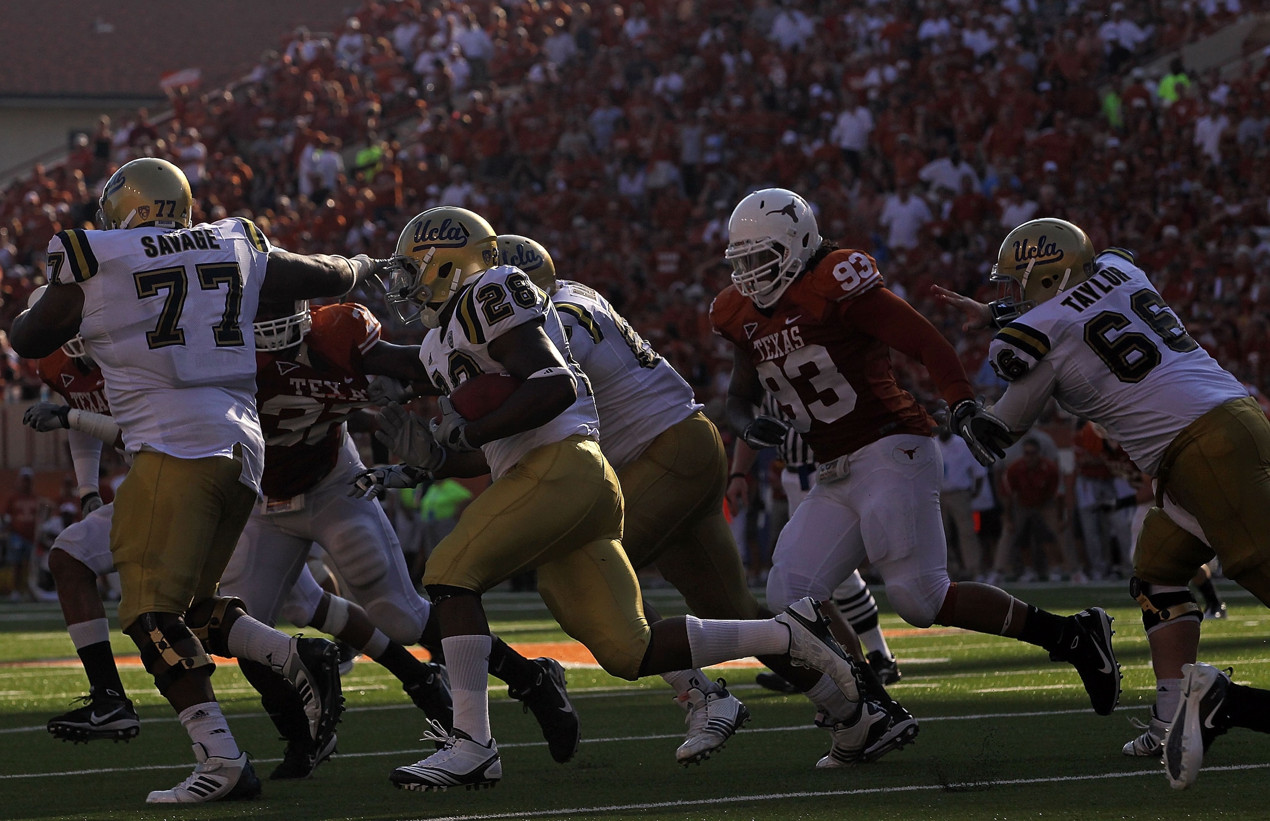 AUSTIN, TX - SEPTEMBER 25:  Tailback Malcolm Jones #28 of the UCLA Bruins runs the ball against the Texas Longhorns at Darrell K Royal-Texas Memorial Stadium on September 25, 2010 in Austin, Texas.  (Photo by Ronald Martinez/Getty Images)