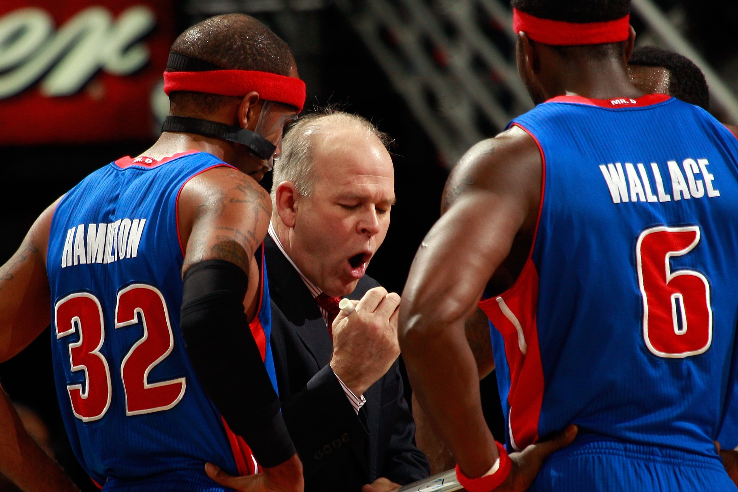 NEW ORLEANS, LA - DECEMBER 08:  Head coach John Keuster of the Detroit Pistons talks with his team during a time out against the New Orleans Hornets at the New Orleans Arena on December 8, 2010 in New Orleans, Louisiana.  NOTE TO USER: User expressly ackn