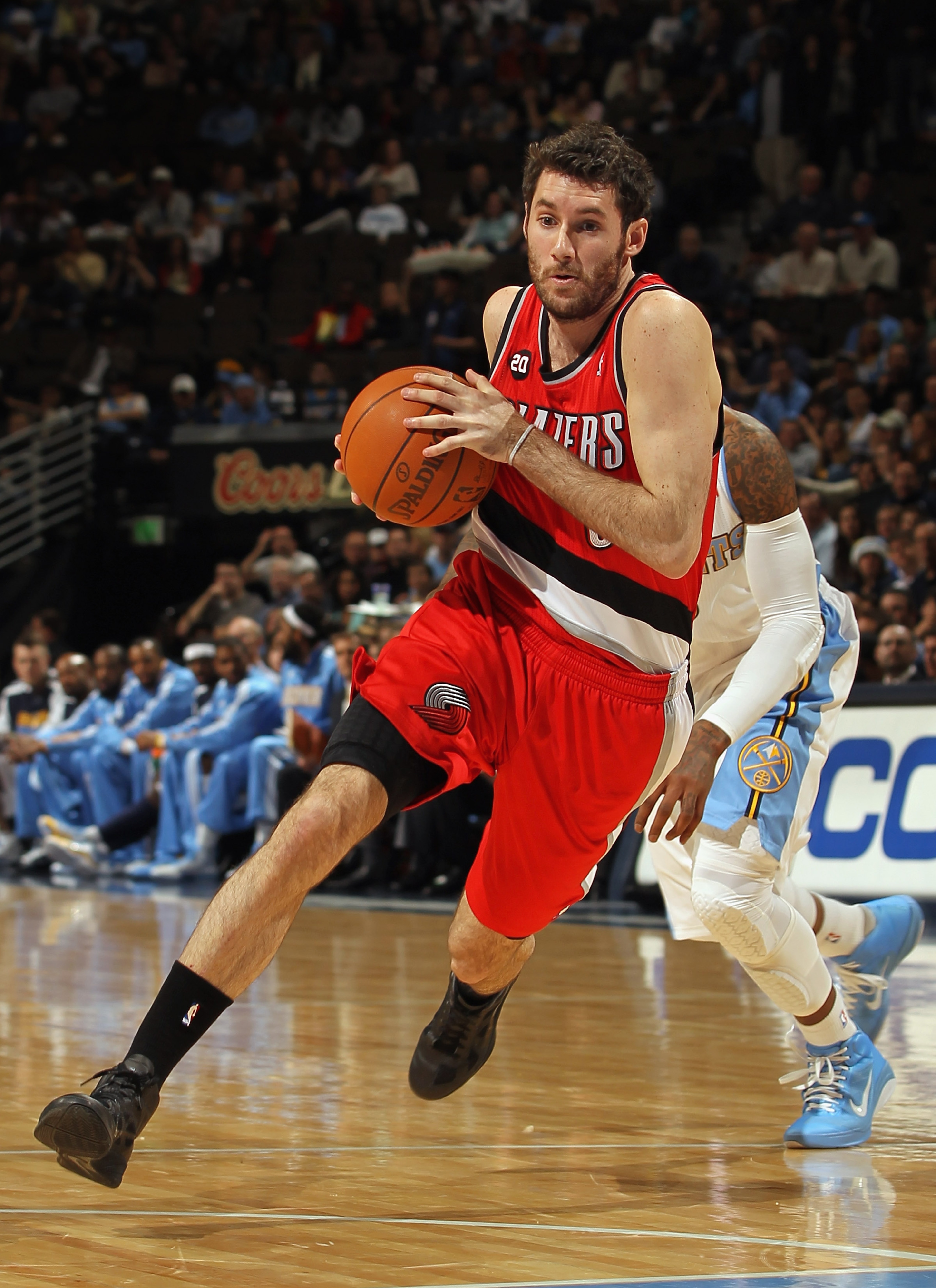 DENVER - DECEMBER 28: Rudy Fernandez #5 of the Portland Trail Blazers dribbles the ball against the Denver Nuggets at Pepsi Center on December 28, 2010 in Denver, Colorado. The Nuggets defeated the Blazers 95-77. NOTE TO USER: User expressly acknowledges DENVER - DECEMBER 28: Rudy Fernandez #5 of the Portland Trail Blazers dribbles the ball against the Denver Nuggets at Pepsi Center on December 28, 2010 in Denver, Colorado. The Nuggets defeated the Blazers 95-77. NOTE TO USER: User expressly acknowledges