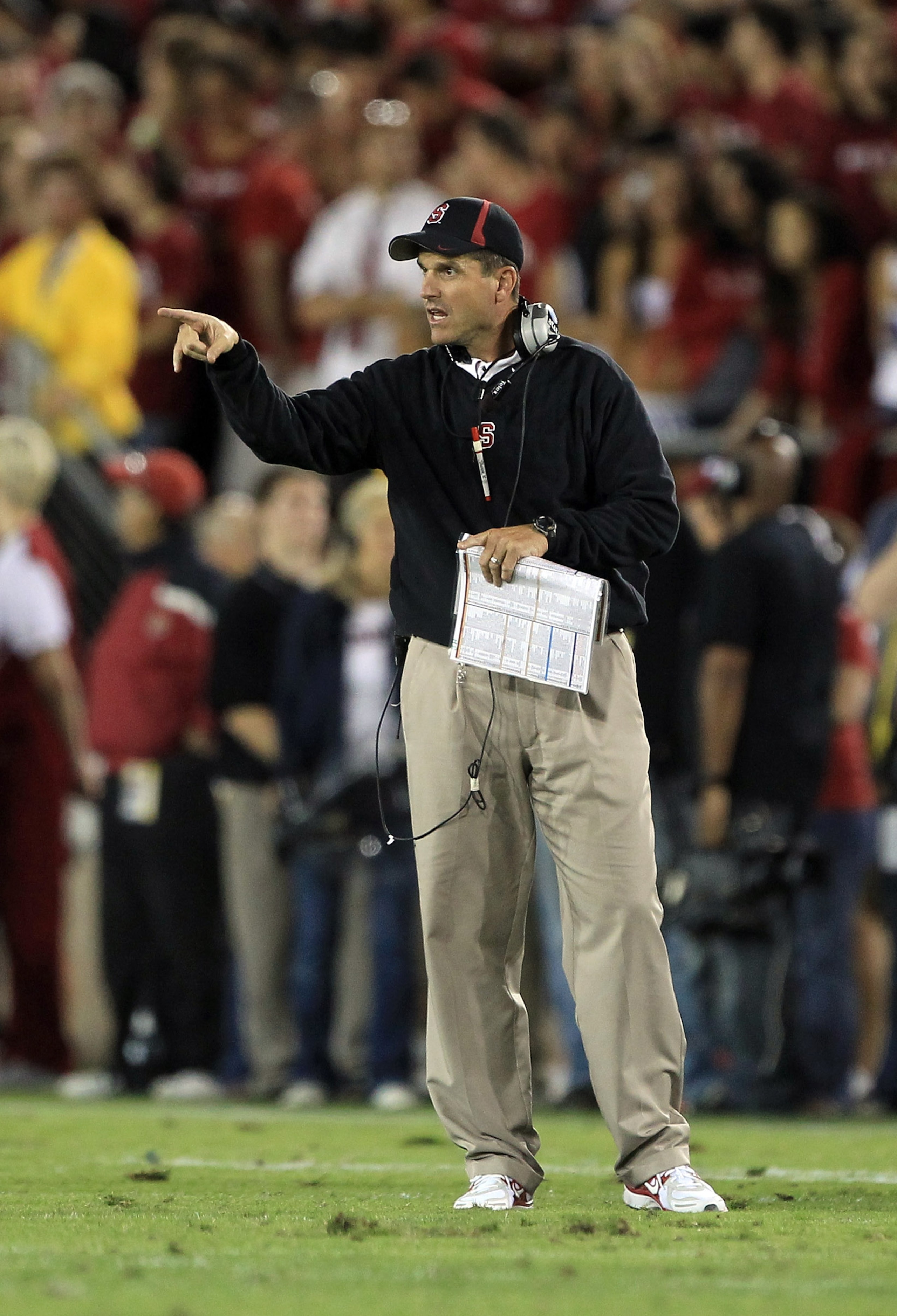 PALO ALTO, CA - OCTOBER 09:  Head coach Jim Harbaugh of the Stanford Cardinal points to the referee during their game against the USC Trojans at Stanford Stadium on October 9, 2010 in Palo Alto, California.  (Photo by Ezra Shaw/Getty Images)