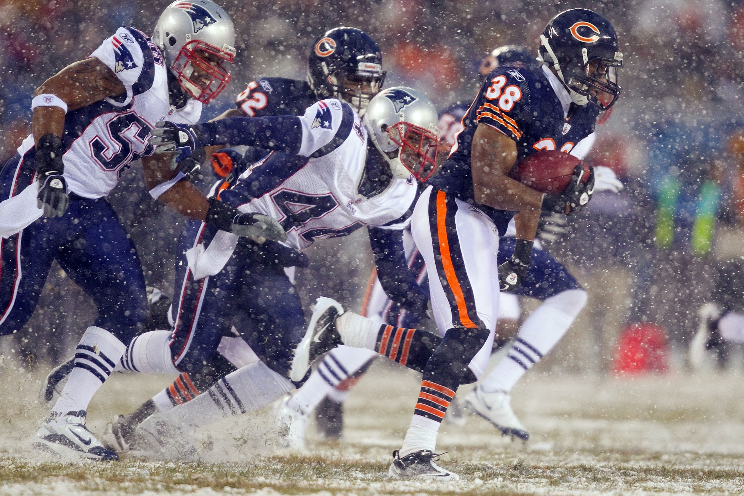 CHICAGO, IL - DECEMBER 12: Jarrad Page #44 and Gary Guyton #59 both of the New England Patriots chase down Danieal Manning #38 of the Chicago Bears at Soldier Field on December 12, 2010 in Chicago, Illinois.  The Patriots beat the Bears 36-7.  (Photo by D