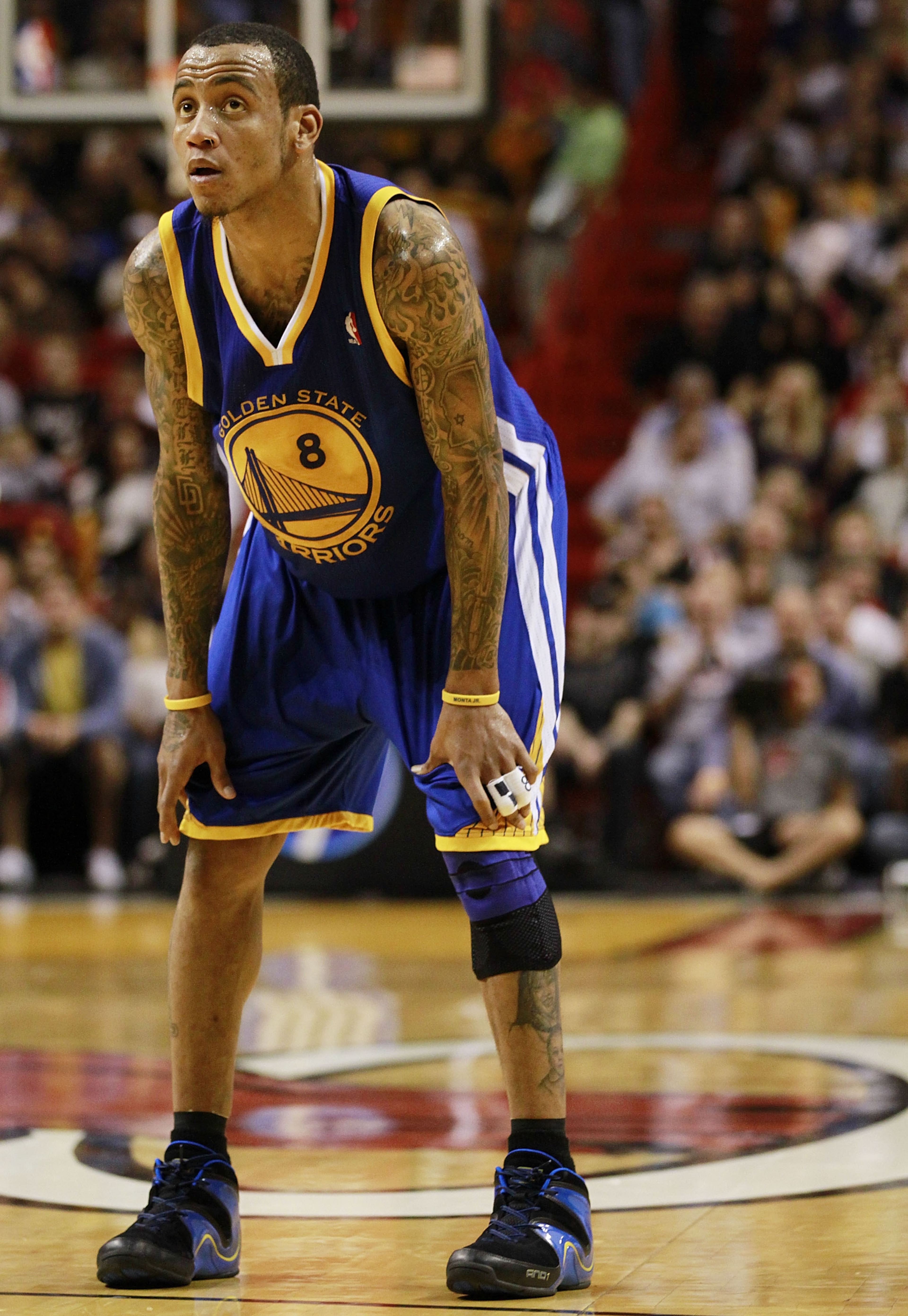 MIAMI - JANUARY 01: Monta Ellis # 8 of the Golden State Warriors looks on during a game against the Miami Heat at American Airlines Arena on January 1, 2011 in Miami, Florida. The Heat won 114-107. NOTE TO USER: User expressly acknowledges and agrees tha MIAMI - JANUARY 01: Monta Ellis # 8 of the Golden State Warriors looks on during a game against the Miami Heat at American Airlines Arena on January 1, 2011 in Miami, Florida. The Heat won 114-107. NOTE TO USER: User expressly acknowledges and agrees tha