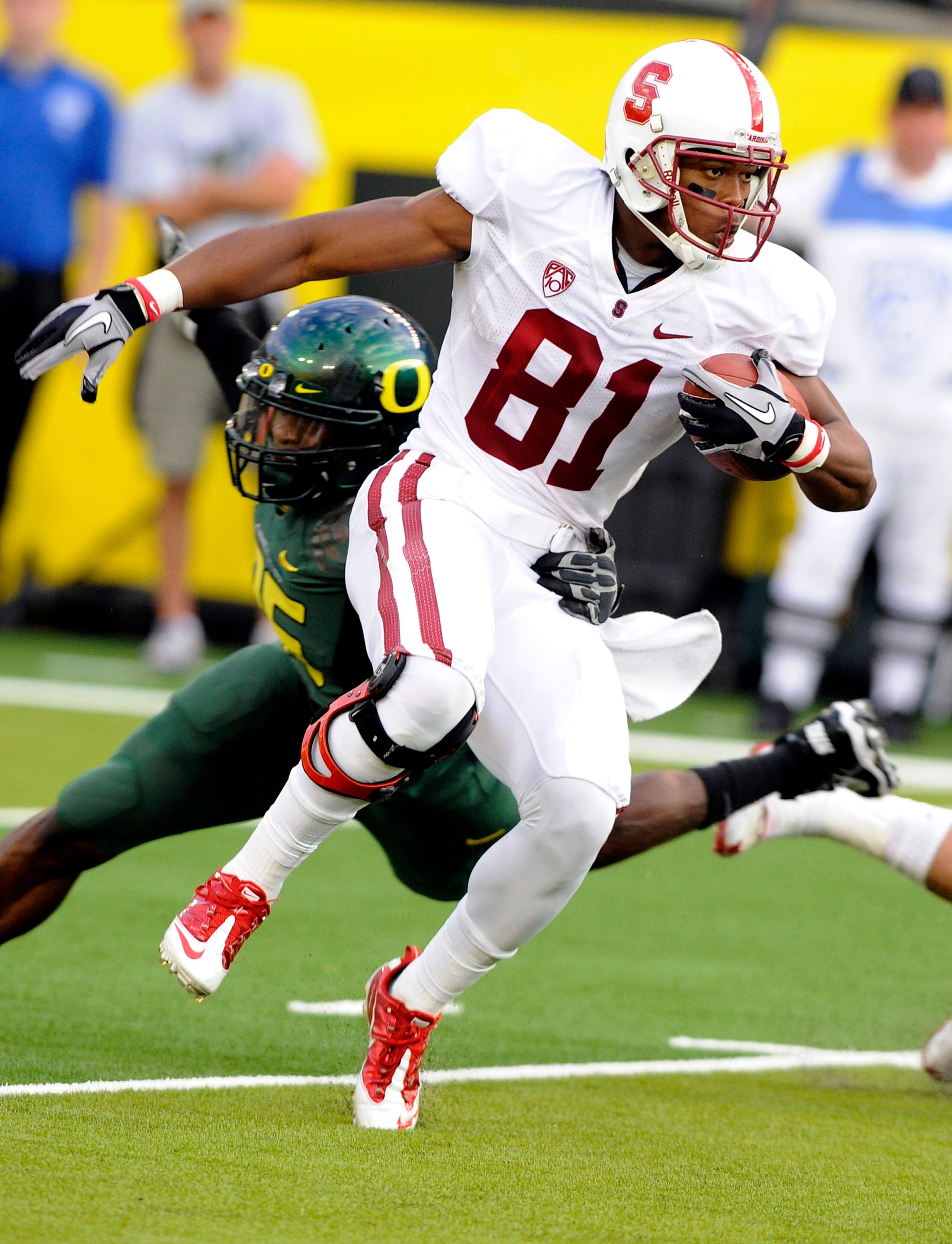 EUGENE, OR - OCTOBER 2: Wide receiver Chris Owusu #81 of the Stanford Cardinal looks for some running room  as he returns a kick in the second quarter of the game against the Oregon Ducks at Autzen Stadium on October 2, 2010 in Eugene, Oregon. Oregon won