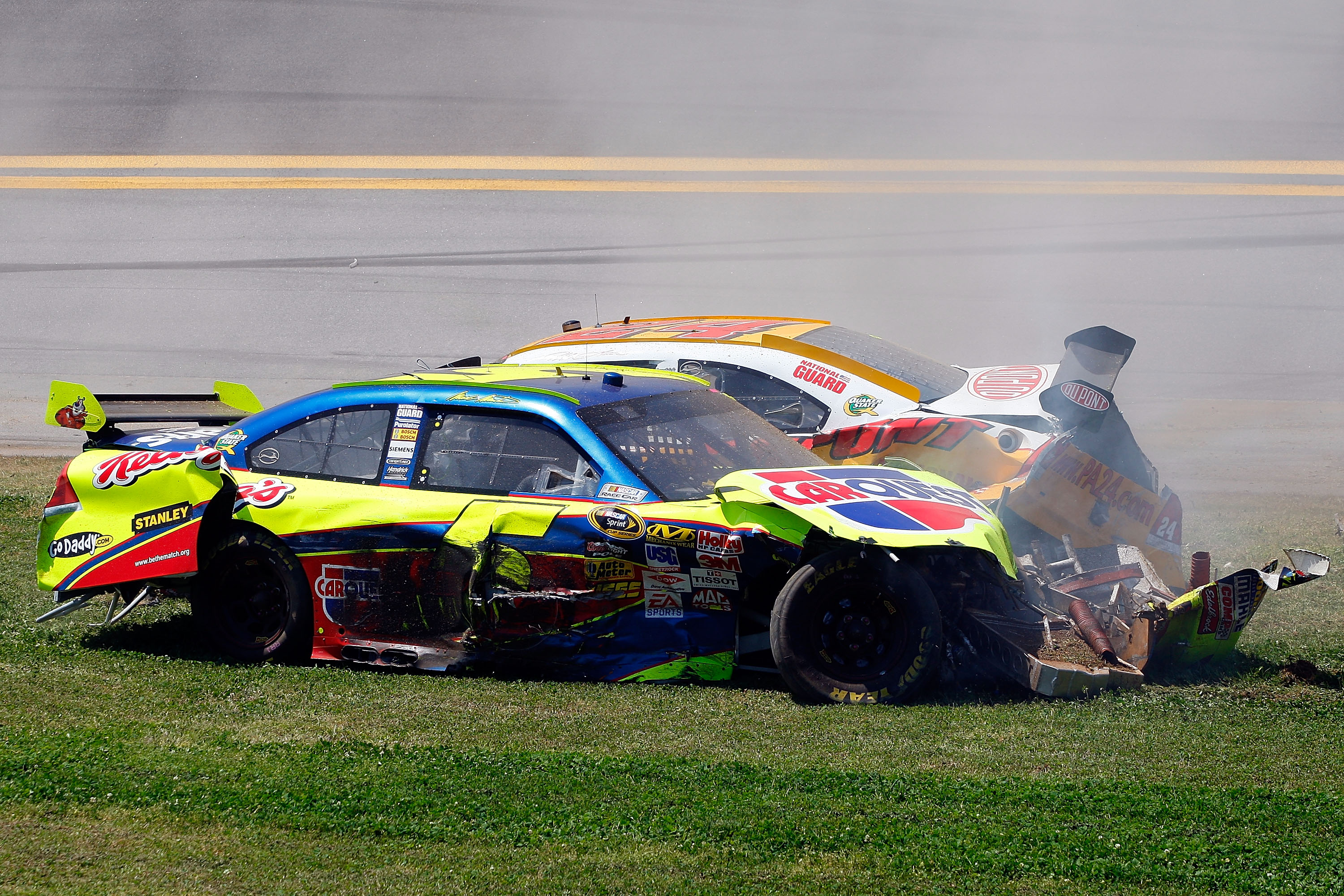 TALLADEGA, AL - APRIL 26:  Mark Martin, driver of the #5 Carquest/Kellogg's Chevrolet, and Jeff Gordon, driver of the #24 Dupont/Pepsi Chevrolet, come to a rest after a multi-car incident during the NASCAR Sprint Cup Series Aaron's 499 at Talladega Supers
