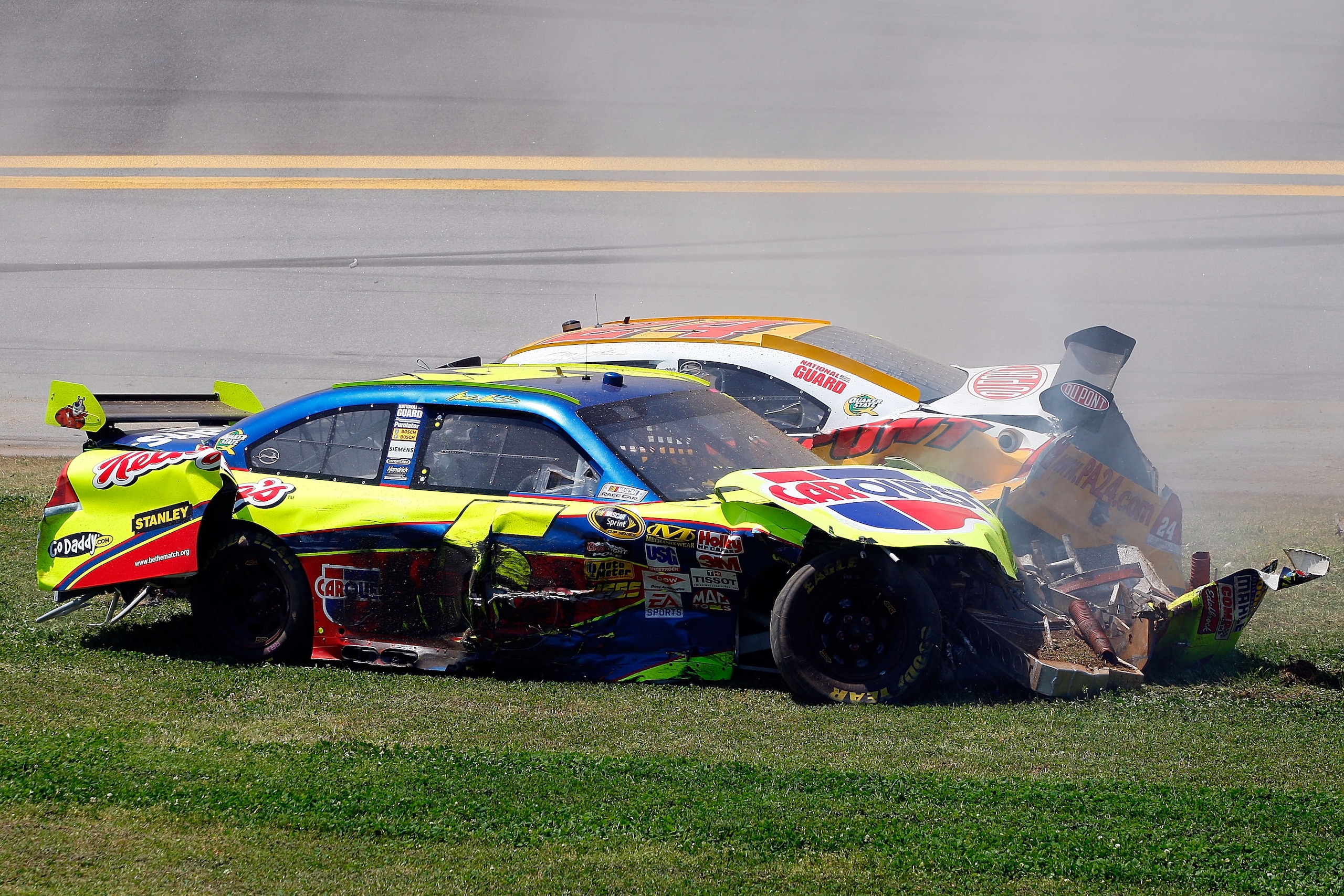 TALLADEGA, AL - APRIL 26:  Mark Martin, driver of the #5 Carquest/Kellogg's Chevrolet, and Jeff Gordon, driver of the #24 Dupont/Pepsi Chevrolet, come to a rest after a multi-car incident during the NASCAR Sprint Cup Series Aaron's 499 at Talladega Supers
