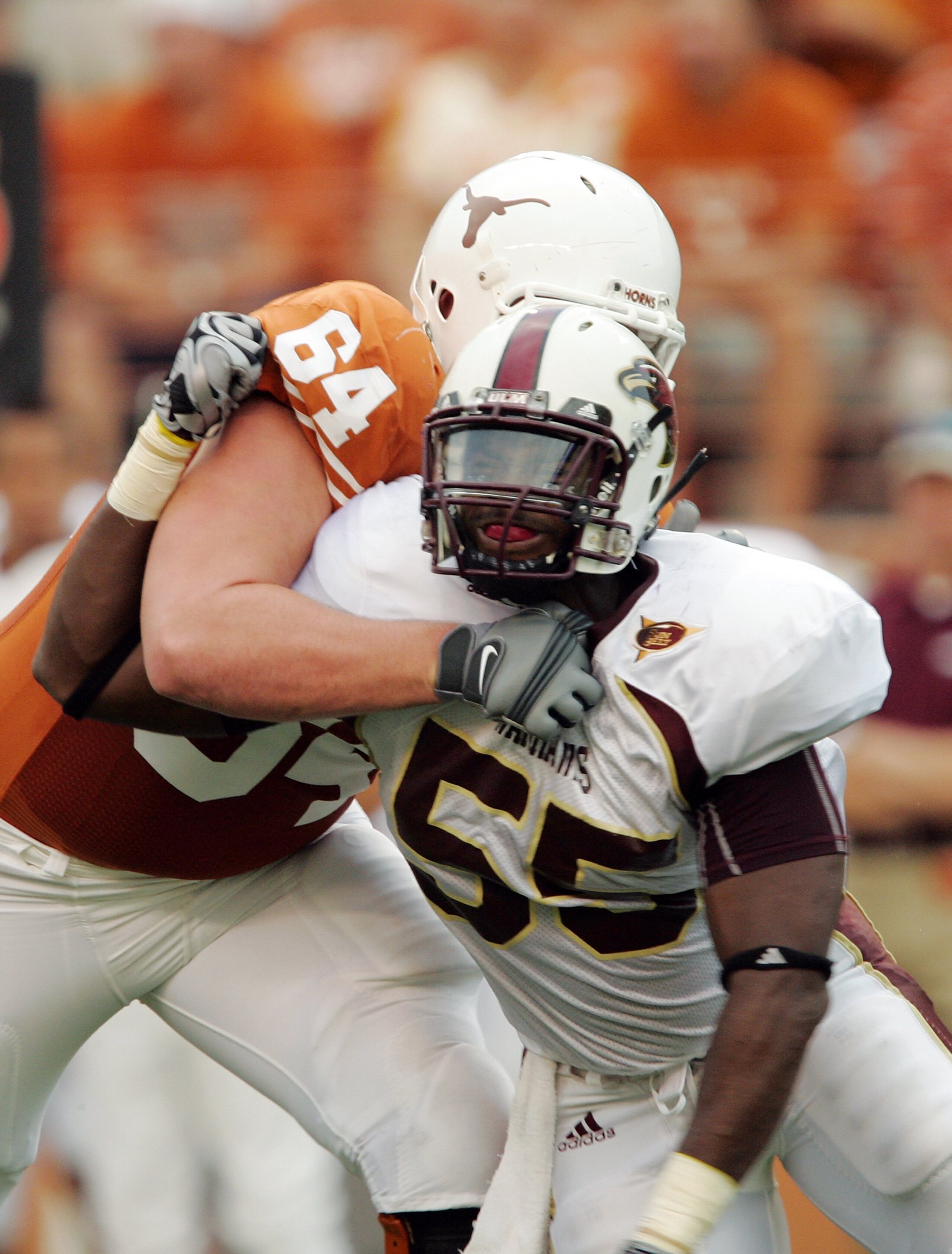 AUSTIN, TX - SEPTEMBER 5:  Defensive end Troy Evans #55 of the Louisiana Monroe Warhawks rushes the quarterback against outside tackle Kyle Hix #64 of the Texas Longhorns on September 5, 2009 at Darrell K Royal-Texas Memorial Stadium in Austin, Texas. The