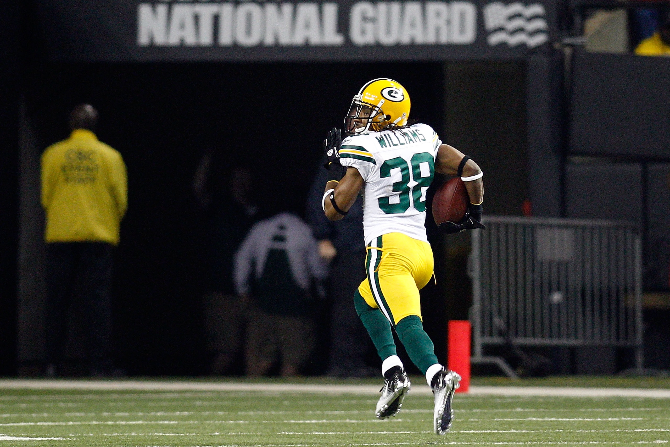 ATLANTA, GA - JANUARY 15: Tramon Williams ##8 of the Green Bay Packers returns an interception 70-yards for a touchdown in the second quarter against the Atlanta Falcons during their 2011 NFC divisional playoff game at Georgia Dome on January 15, 2011 in ATLANTA, GA - JANUARY 15: Tramon Williams ##8 of the Green Bay Packers returns an interception 70-yards for a touchdown in the second quarter against the Atlanta Falcons during their 2011 NFC divisional playoff game at Georgia Dome on January 15, 2011 in