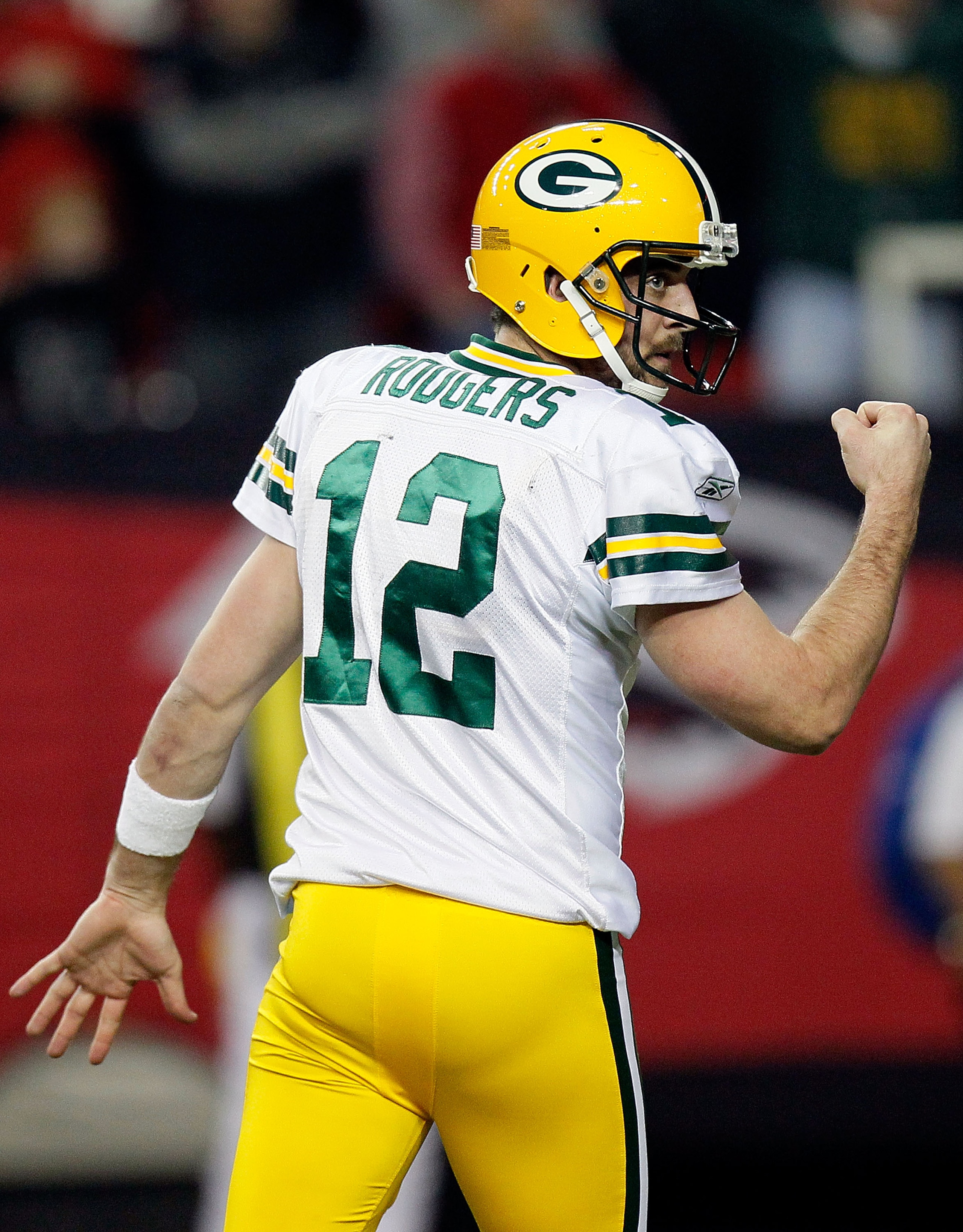 ATLANTA, GA - JANUARY 15: Aaron Rodgers #12 of the Green Bay Packers reacts in the second quarter against the Atlanta Falcons during their 2011 NFC divisional playoff game at Georgia Dome on January 15, 2011 in Atlanta, Georgia. The Packers won 48-21. ( ATLANTA, GA - JANUARY 15: Aaron Rodgers #12 of the Green Bay Packers reacts in the second quarter against the Atlanta Falcons during their 2011 NFC divisional playoff game at Georgia Dome on January 15, 2011 in Atlanta, Georgia. The Packers won 48-21. (