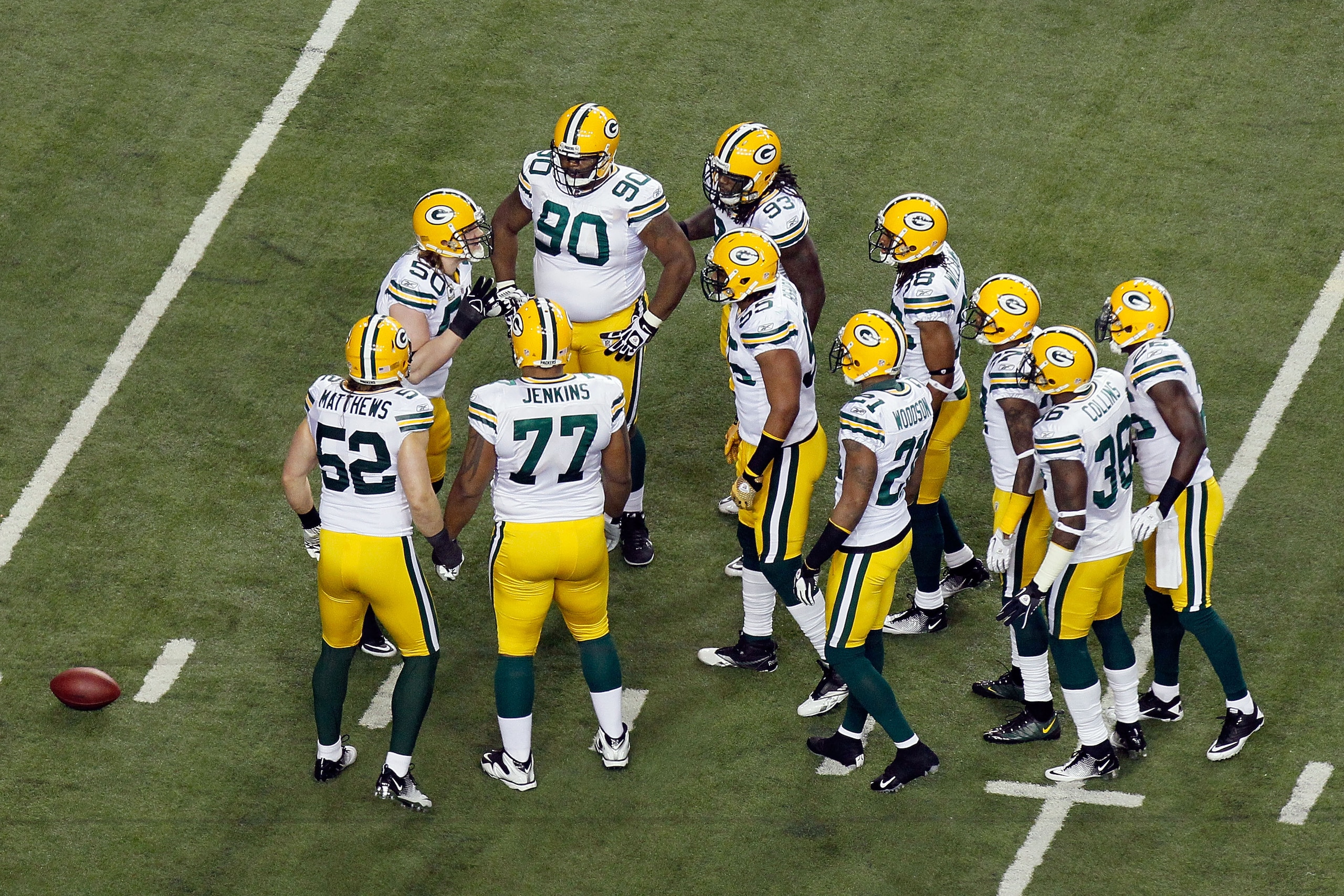 ATLANTA, GA - JANUARY 15: A.J. Hawk #50 of the Green Bay Packers calls a play in the defensive huddle to teammates including Clay Matthews #52 and B.J. Raji #90 against the Atlanta Falcons during their 2011 NFC divisional playoff game at Georgia Dome on ATLANTA, GA - JANUARY 15: A.J. Hawk #50 of the Green Bay Packers calls a play in the defensive huddle to teammates including Clay Matthews #52 and B.J. Raji #90 against the Atlanta Falcons during their 2011 NFC divisional playoff game at Georgia Dome on