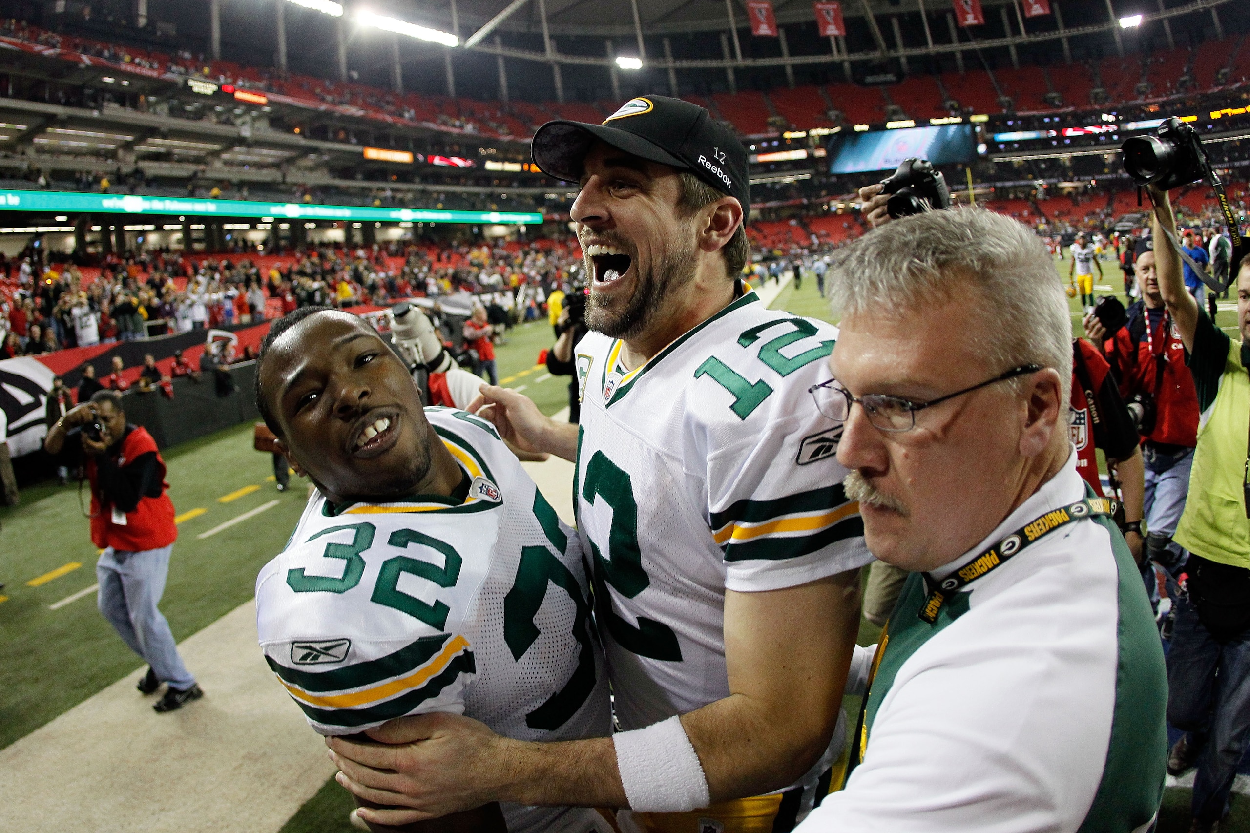 ATLANTA, GA - JANUARY 15: Aaron Rodgers #12 and Brandon Jackson #32 of the Green Bay Packers celebrate as they walk off the field after the Packers won 48-21 against the Atlanta Falcons during their 2011 NFC divisional playoff game at Georgia Dome on Jan ATLANTA, GA - JANUARY 15: Aaron Rodgers #12 and Brandon Jackson #32 of the Green Bay Packers celebrate as they walk off the field after the Packers won 48-21 against the Atlanta Falcons during their 2011 NFC divisional playoff game at Georgia Dome on Jan