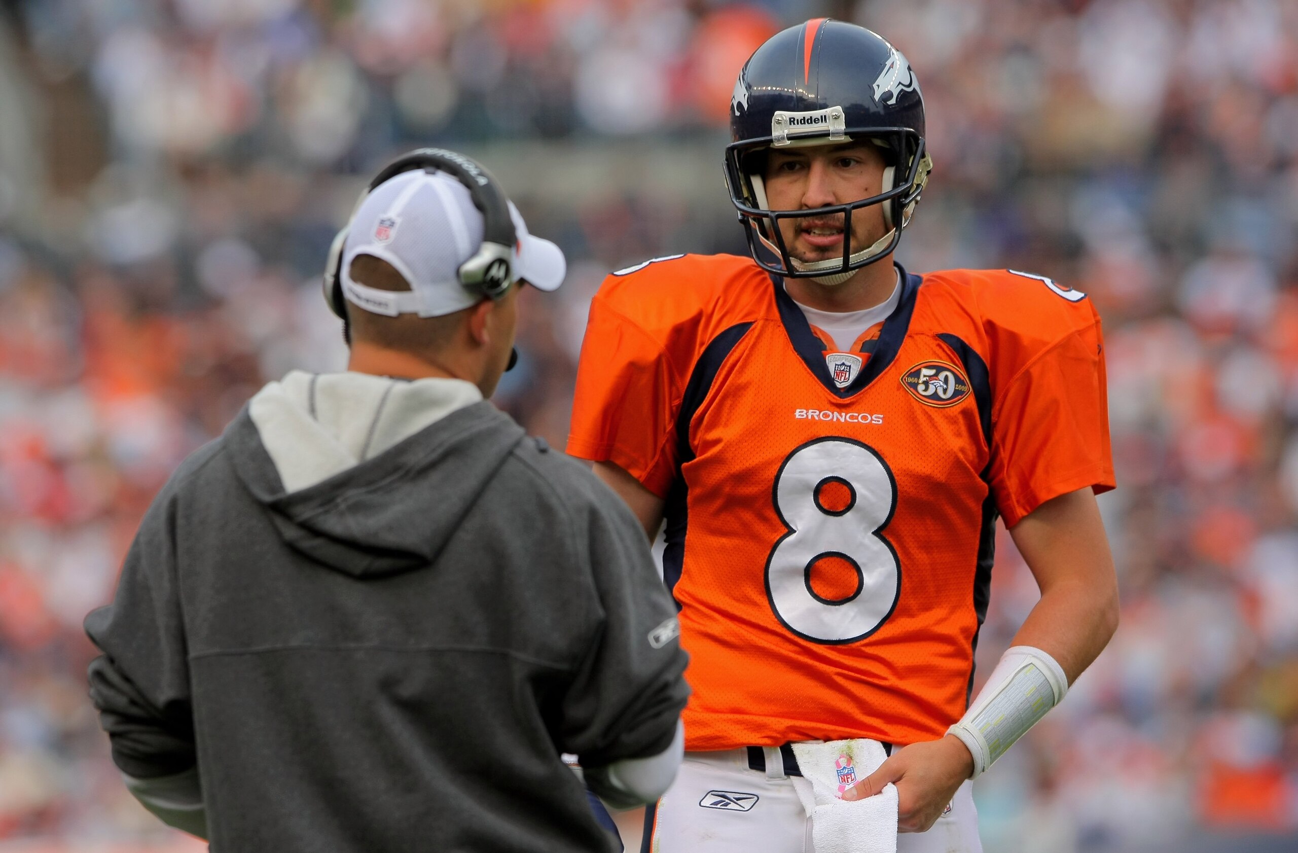 DENVER - OCTOBER 04: Quarterback Kyle Orton #8 of the Denver Broncos converses with head coach Josh McDaniels against the Dallas Cowboys during NFL action at Invesco Field at Mile High on October 4, 2009 in Denver, Colorado. The Broncos defeated the Cowb DENVER - OCTOBER 04: Quarterback Kyle Orton #8 of the Denver Broncos converses with head coach Josh McDaniels against the Dallas Cowboys during NFL action at Invesco Field at Mile High on October 4, 2009 in Denver, Colorado. The Broncos defeated the Cowb