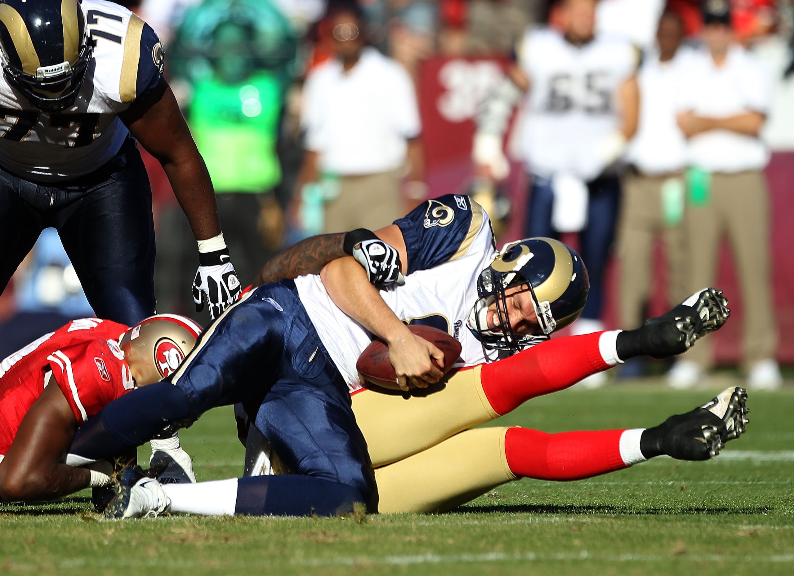 SAN FRANCISCO - NOVEMBER 14: Sam Bradford #8 of the St. Louis Rams is sacked by the San Francisco 49ers at Candlestick Park on November 14, 2010 in San Francisco, California. (Photo by Ezra Shaw/Getty Images) SAN FRANCISCO - NOVEMBER 14: Sam Bradford #8 of the St. Louis Rams is sacked by the San Francisco 49ers at Candlestick Park on November 14, 2010 in San Francisco, California. (Photo by Ezra Shaw/Getty Images)