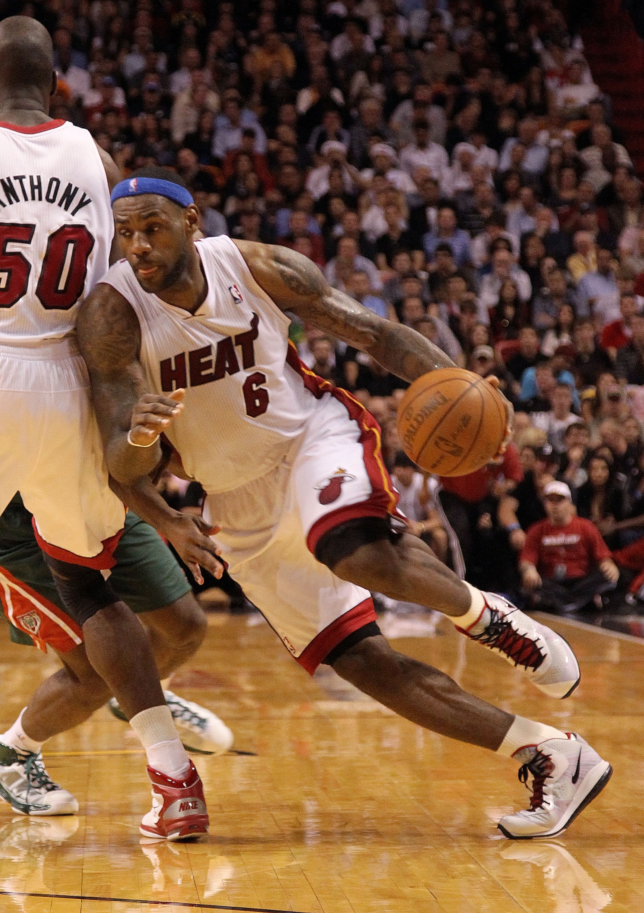 MIAMI, FL - JANUARY 04:  LeBron James #6 of the Miami Heat dribbles around a pick during a game against the Milwaukee Bucks at American Airlines Arena on January 4, 2011 in Miami, Florida. NOTE TO USER: User expressly acknowledges and agrees that, by down