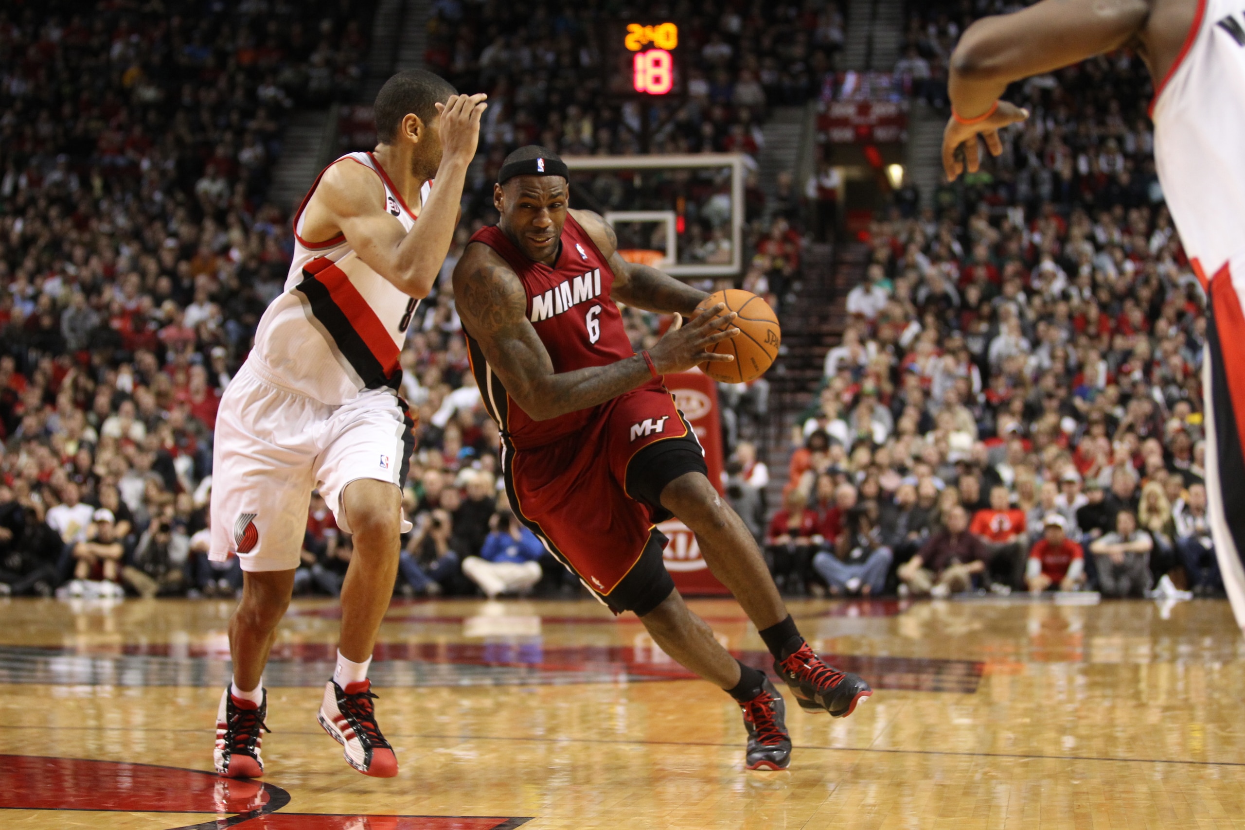 PORTLAND, OR - JANUARY 09: LeBron James #6 of the Miami Heat drives on Nicolas Batum #88 of the Portland Trail Blazers during a game on January 9, 2011 at the Rose Garden Arena in Portland, Oregon. NOTE TO USER: User expressly acknowledges and agrees that
