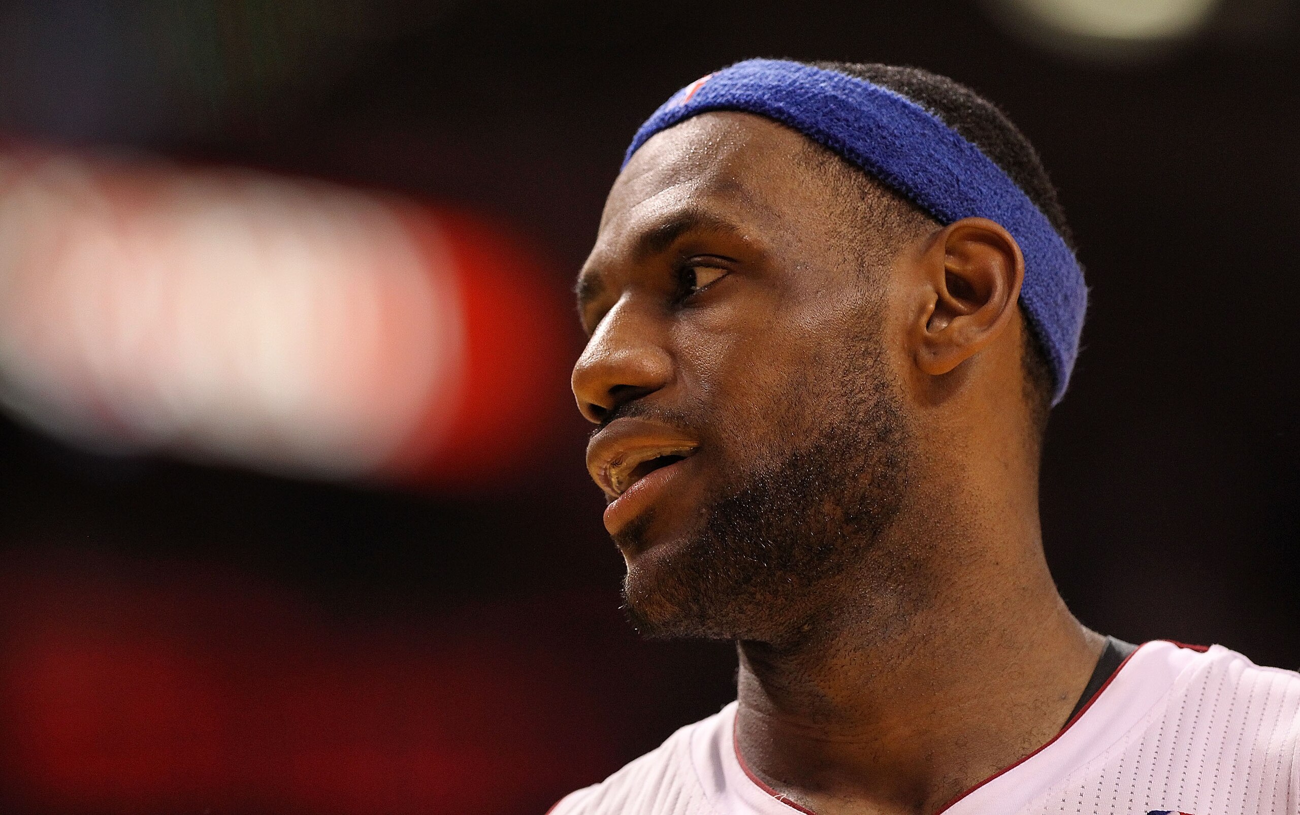 MIAMI, FL - JANUARY 04:  LeBron James #6 of the Miami Heat smiles during a timeout during a game against the Milwaukee Bucks at American Airlines Arena on January 4, 2011 in Miami, Florida. NOTE TO USER: User expressly acknowledges and agrees that, by dow