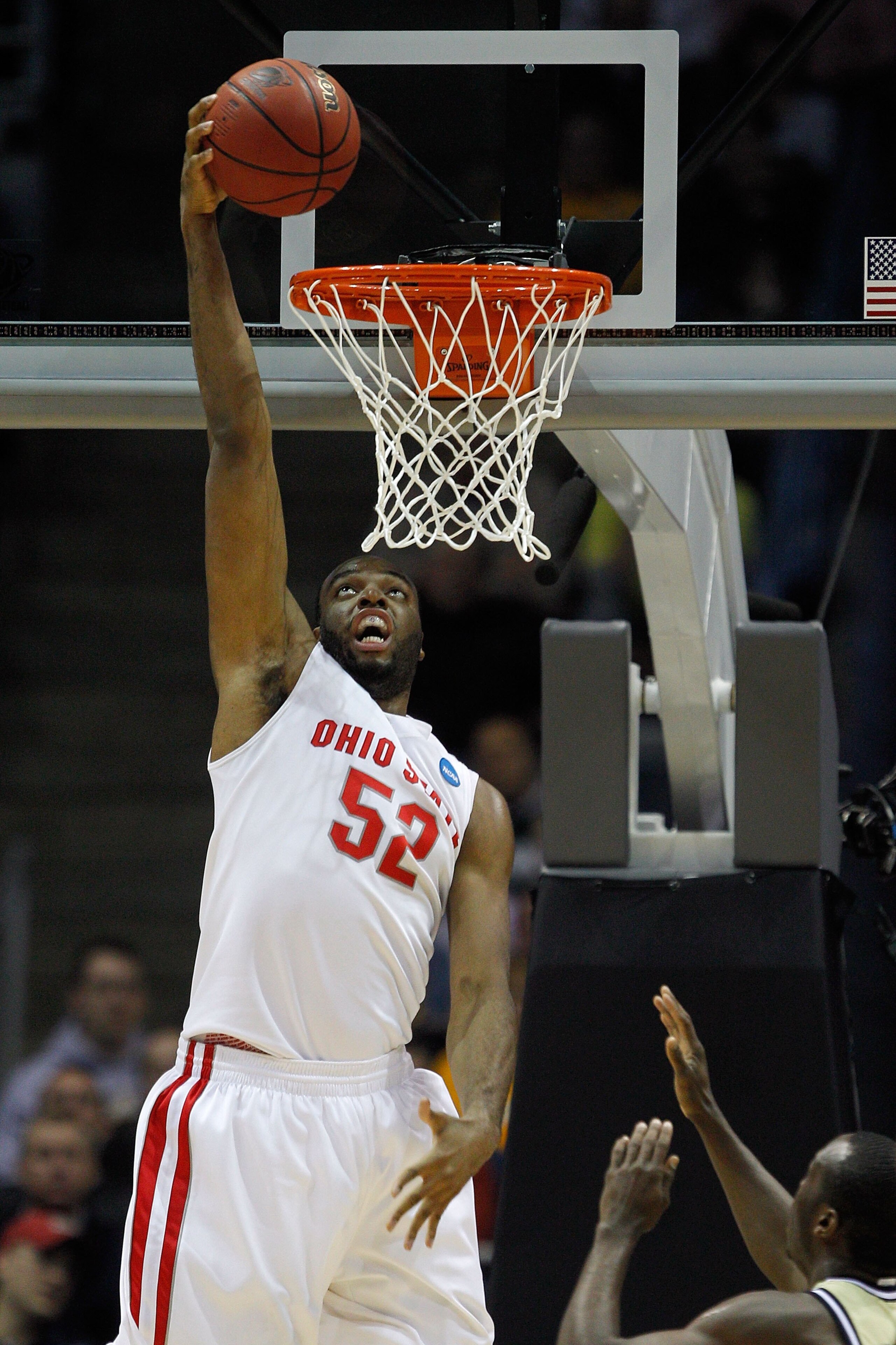 MILWAUKEE - MARCH 21:  Dallas Lauderdale #52 of the Ohio State Buckeyes dunks the ball over Mfon Udofia #0 of the Georgia Tech Yellow Jackets in the first half during the second round of the 2010 NCAA men's basketball tournament at the Bradley Center on M